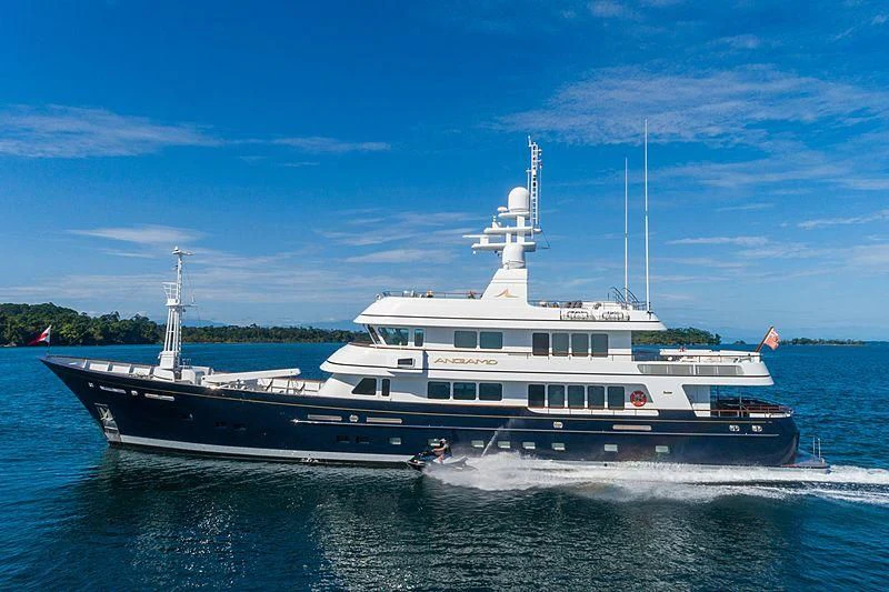 a large white boat on the water aboard MOONSHADOW Yacht for Sale