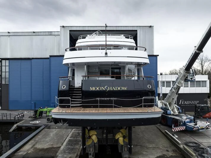 a large boat with a crane aboard MOONSHADOW Yacht for Sale
