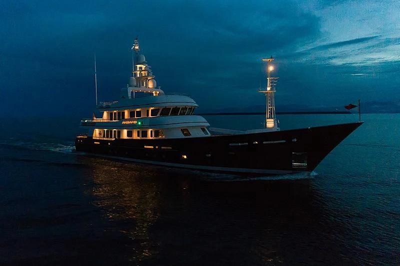 a large ship in the water aboard MOONSHADOW Yacht for Sale