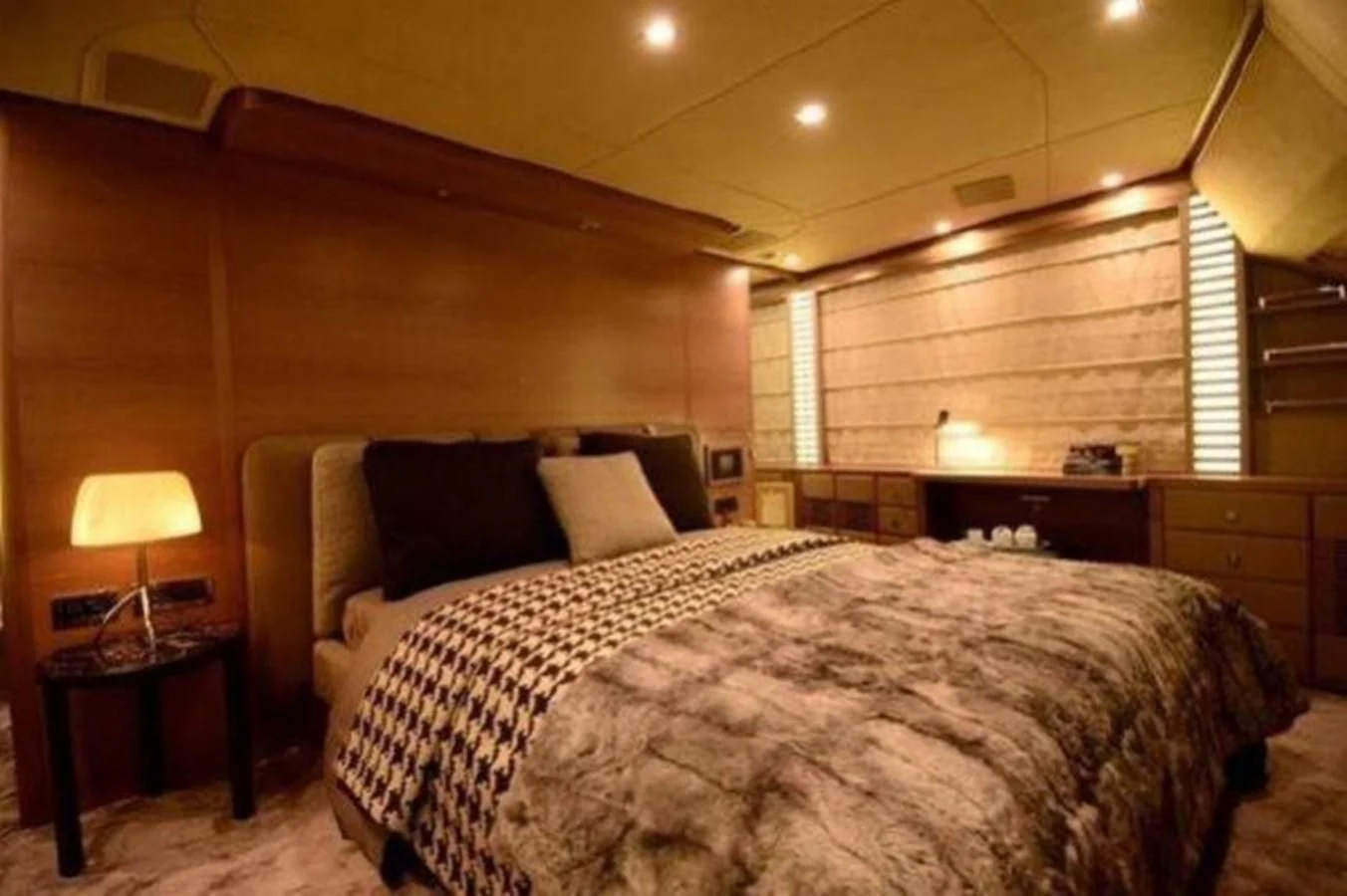 a bedroom with a large bed aboard BENNETTI 105 Yacht for Sale