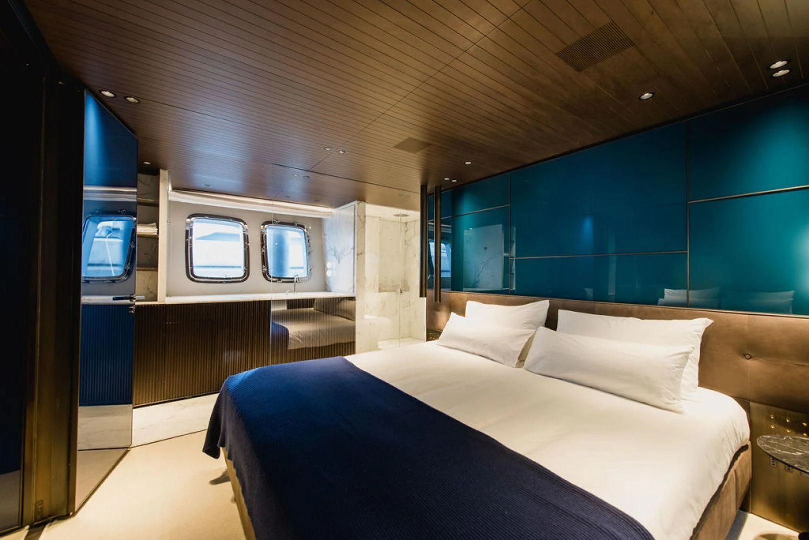 a bed in a room aboard ZAZZAZU II Yacht for Sale