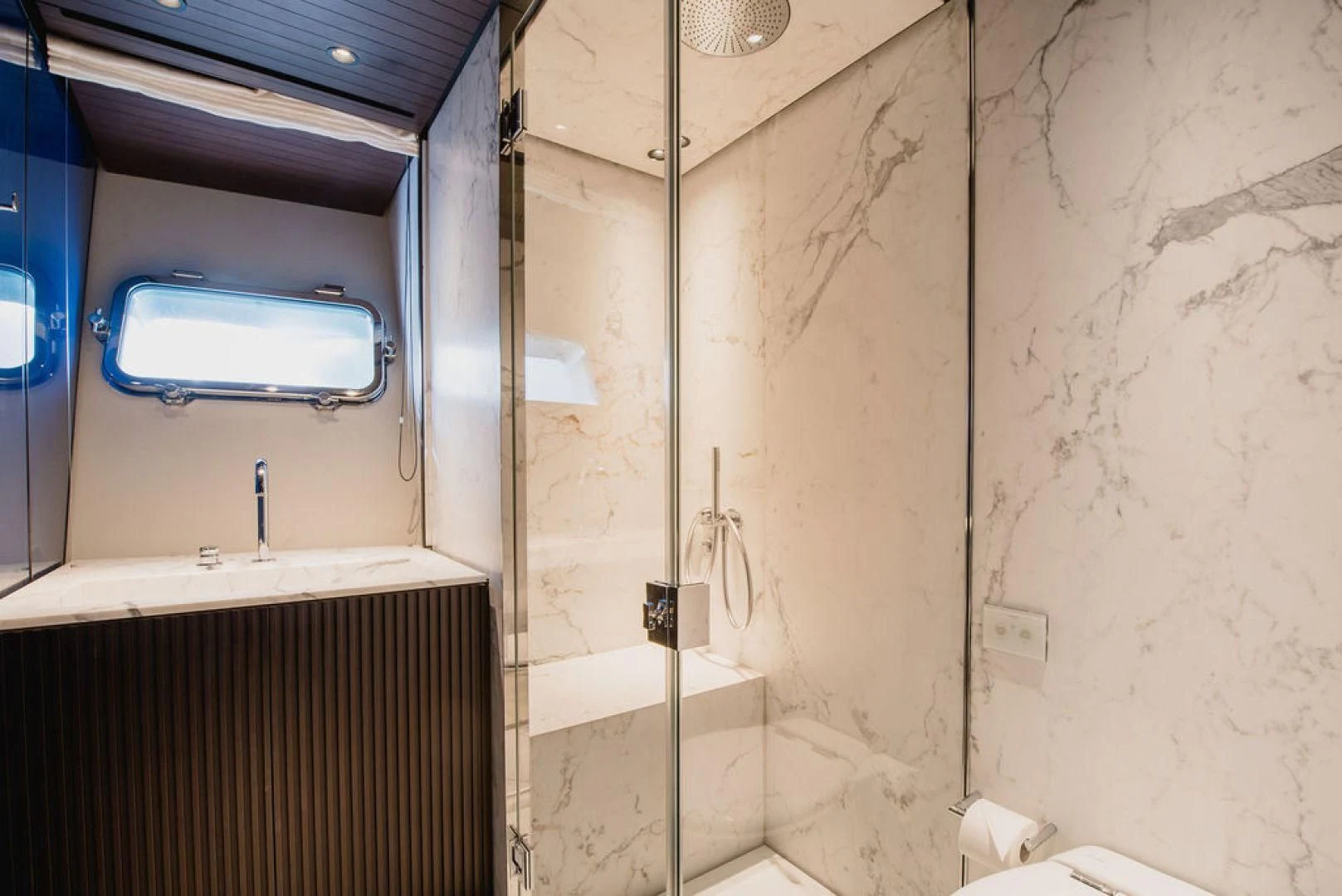 a bathroom with a sink and a mirror aboard ZAZZAZU II Yacht for Sale