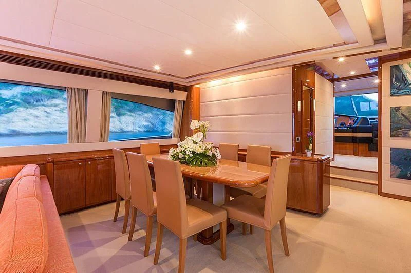 a room with a table and chairs aboard MONTICELLO II Yacht for Sale