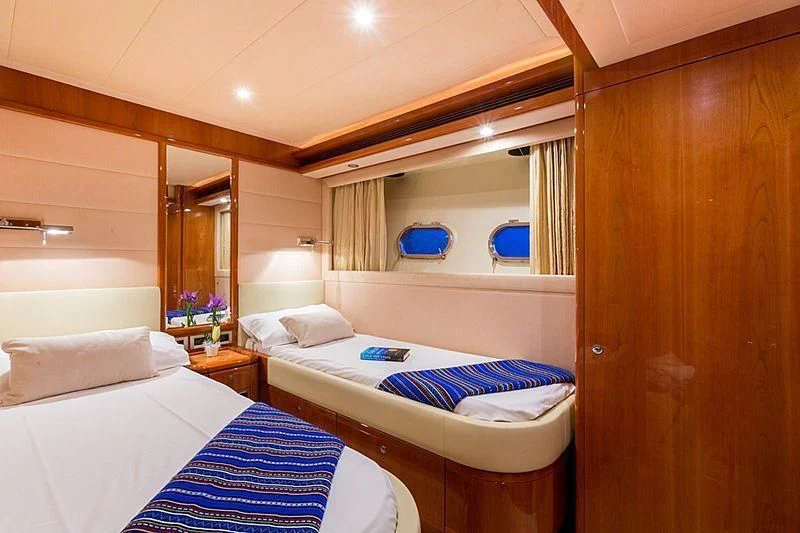 a room with two beds aboard MONTICELLO II Yacht for Sale