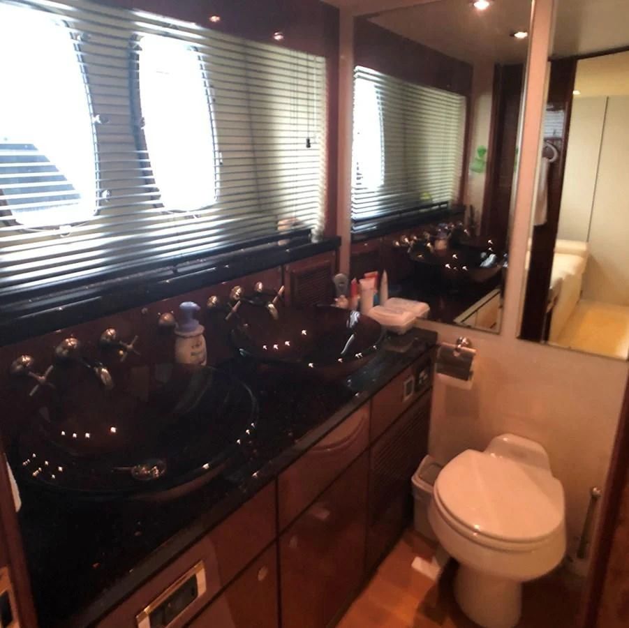 a bathroom with a sink and a toilet aboard FAIRLINE SQUADRON 74 Yacht for Sale