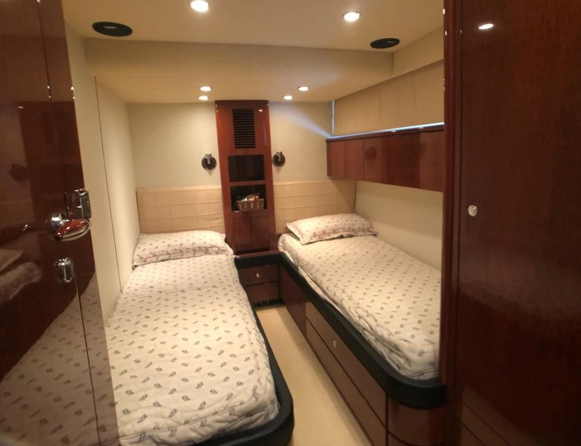 a room with two beds aboard FAIRLINE SQUADRON 74 Yacht for Sale