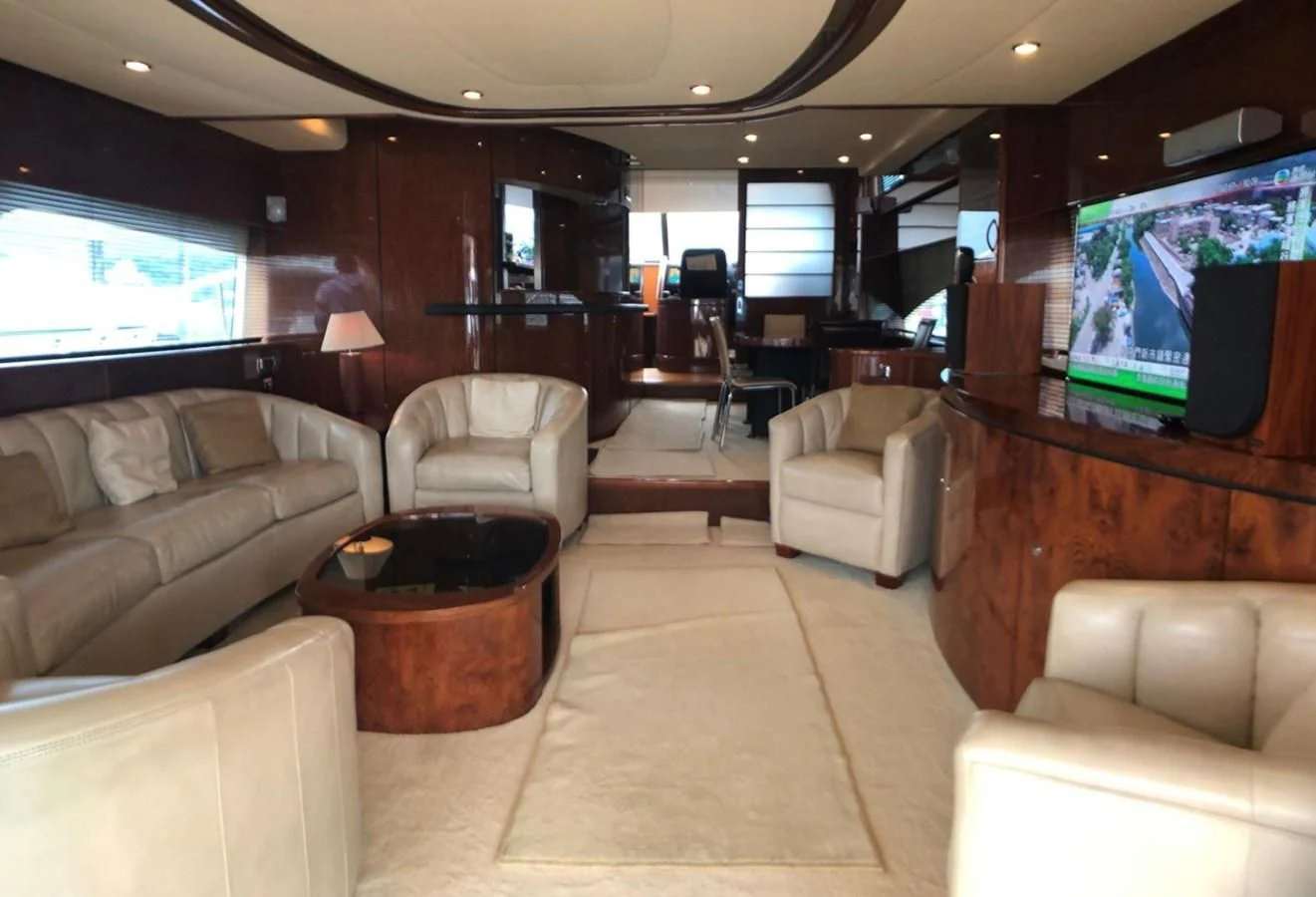 a living room with a large television aboard FAIRLINE SQUADRON 74 Yacht for Sale