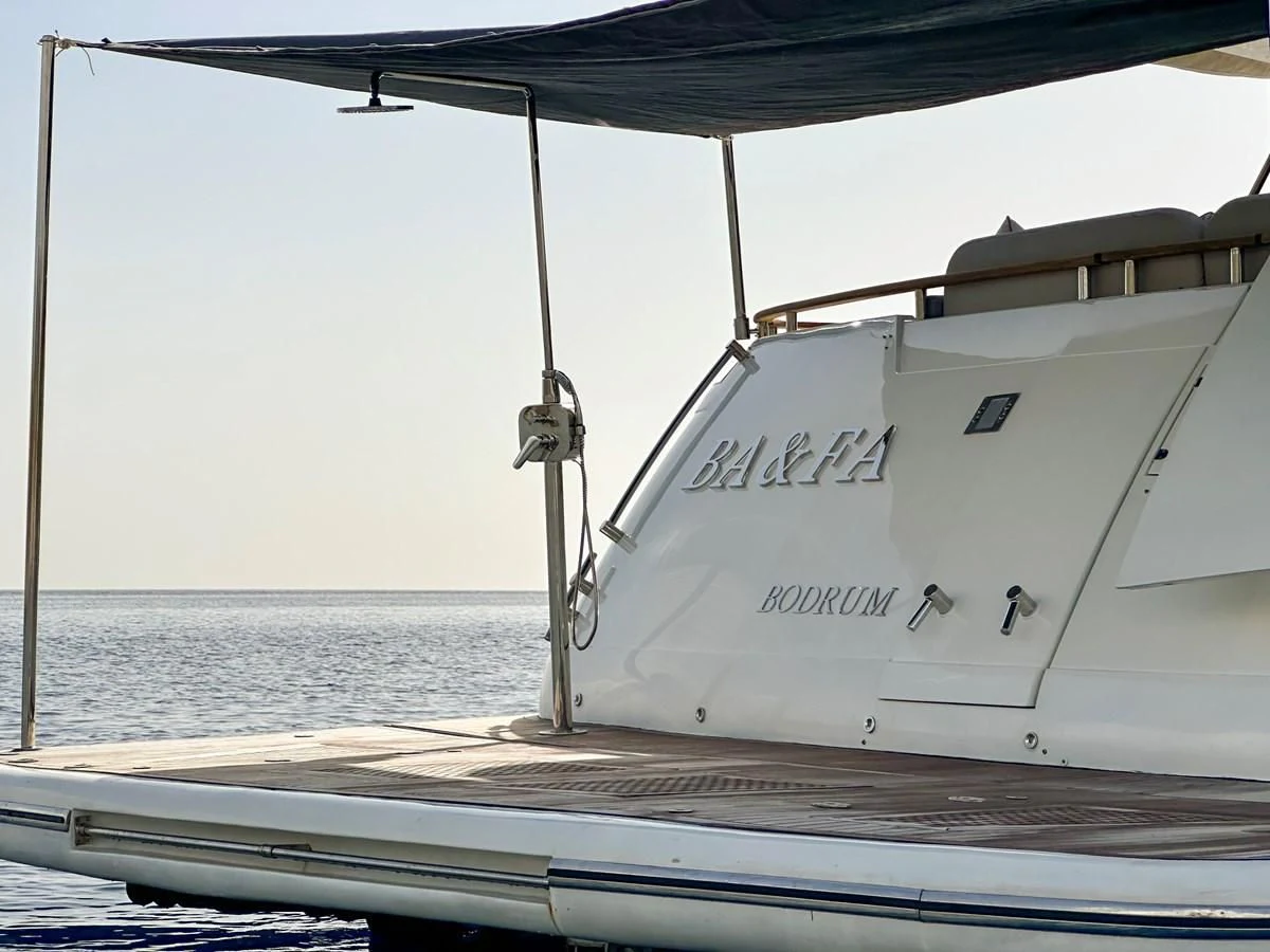 a white boat on a dock aboard FAIRLINE SQUADRON 74 Yacht for Sale