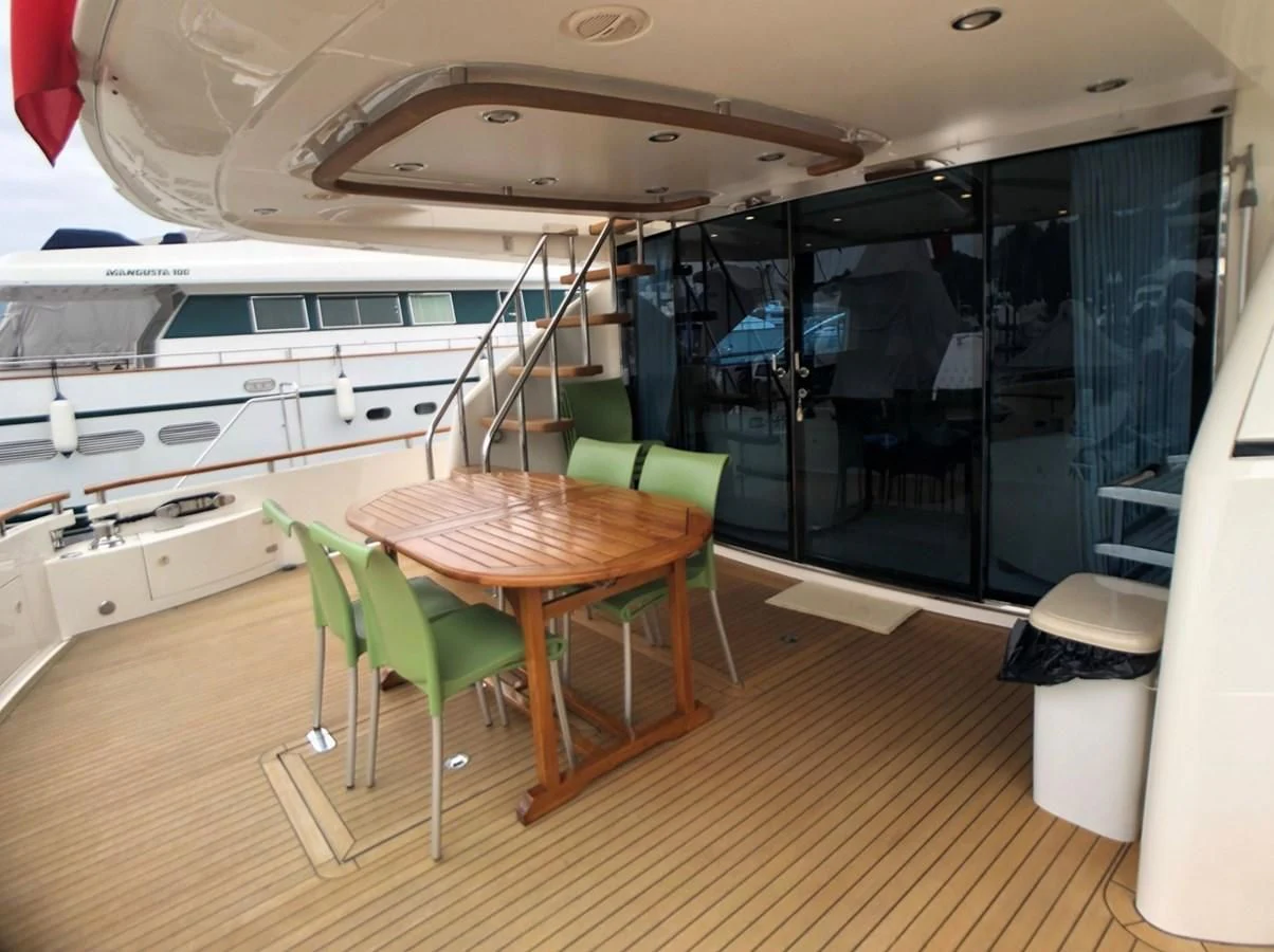 a kitchen with a table and chairs aboard FAIRLINE SQUADRON 74 Yacht for Sale