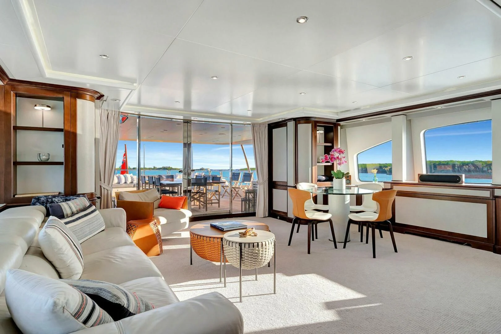 a living room with a large window aboard CRISTOBAL Yacht for Charter