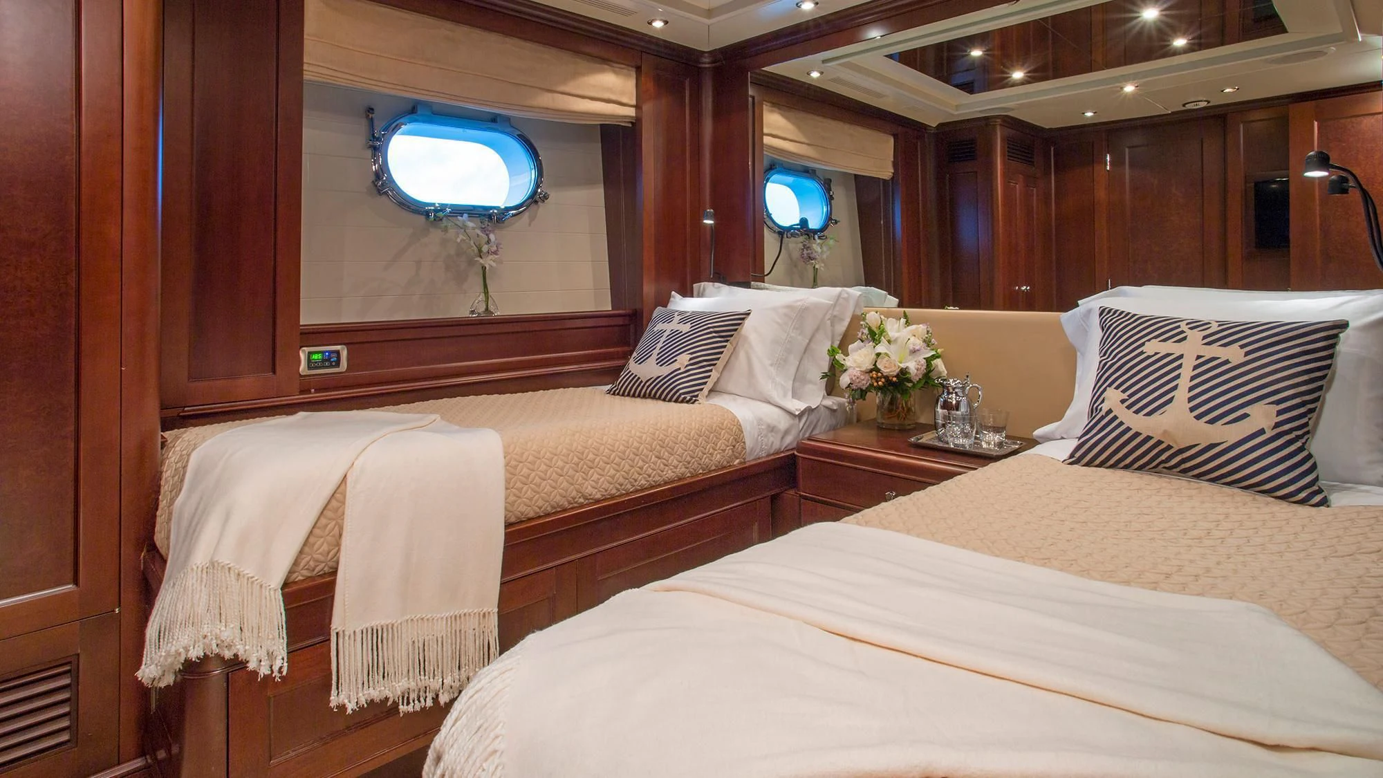 a room with beds and a window aboard CRISTOBAL Yacht for Charter