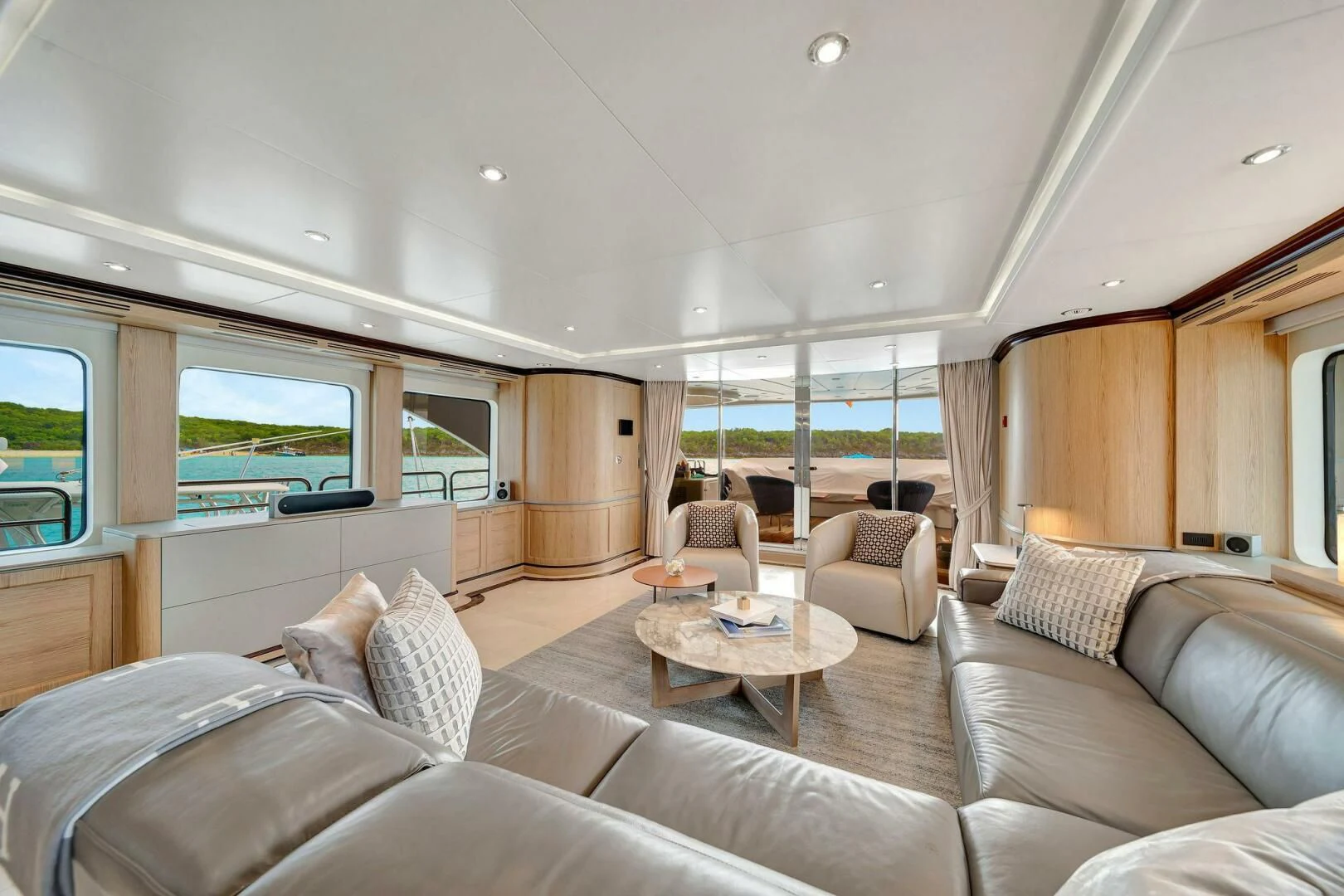 a living room with a large window aboard CRISTOBAL Yacht for Charter