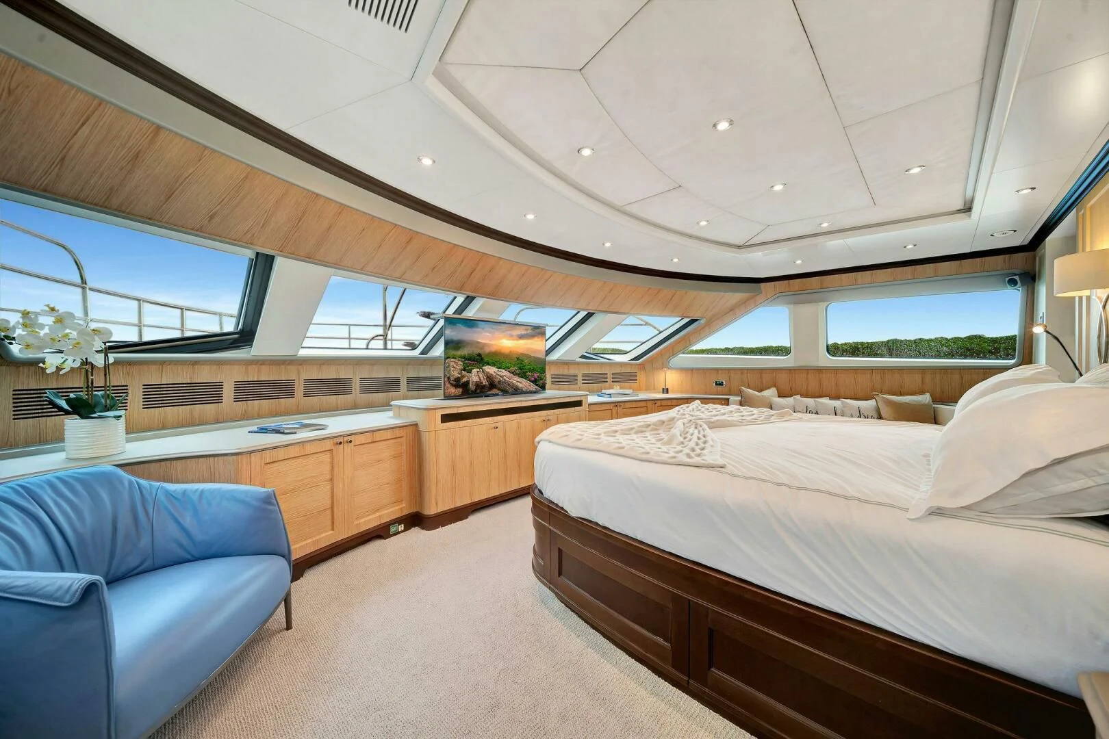 a room with a bed and a couch aboard CRISTOBAL Yacht for Charter