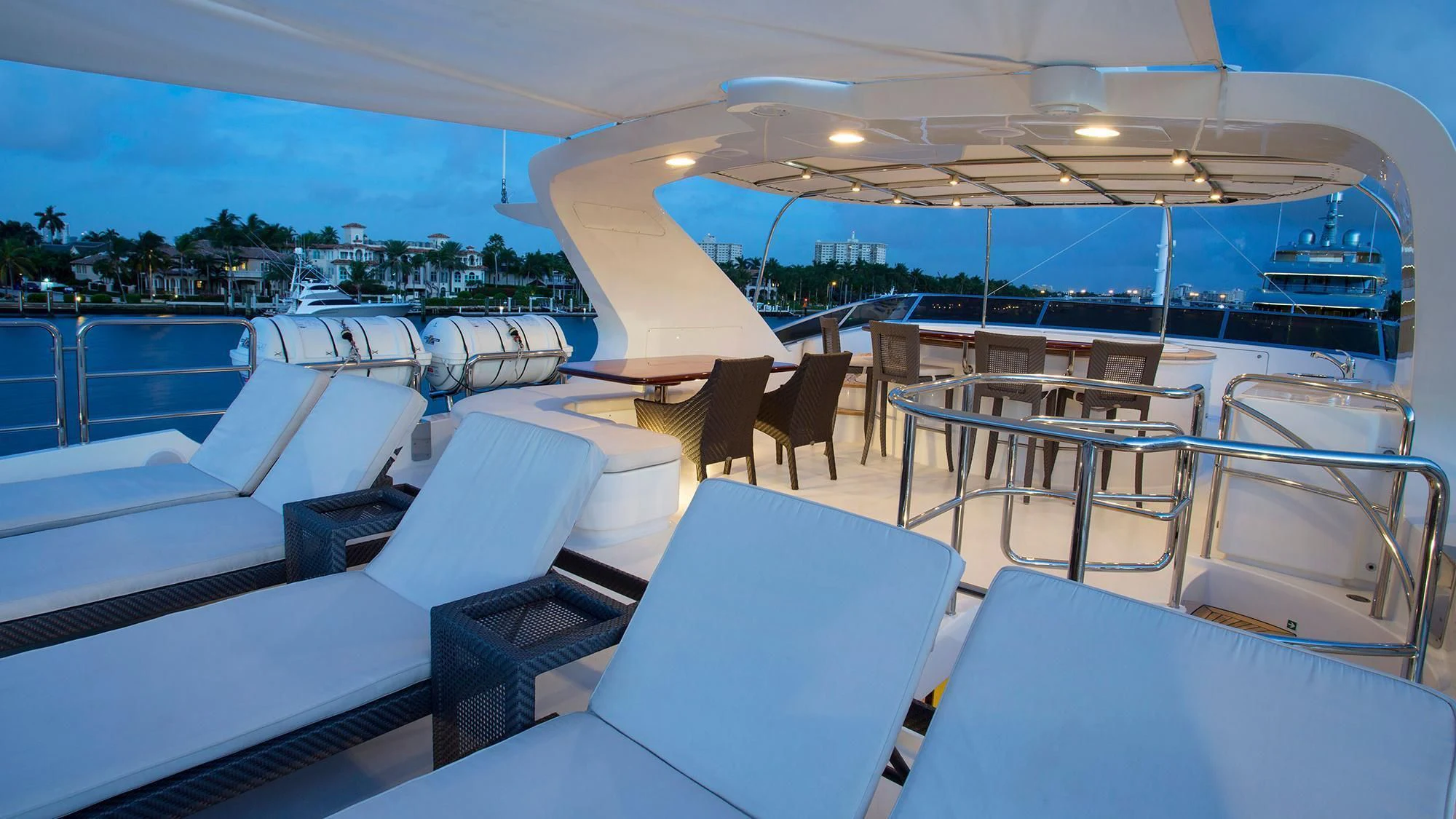 a large pool with chairs and tables aboard CRISTOBAL Yacht for Charter