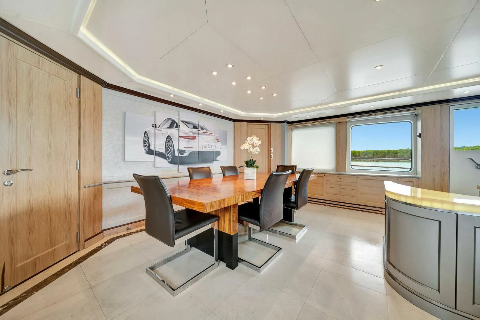 a room with a table and chairs aboard CRISTOBAL Yacht for Charter