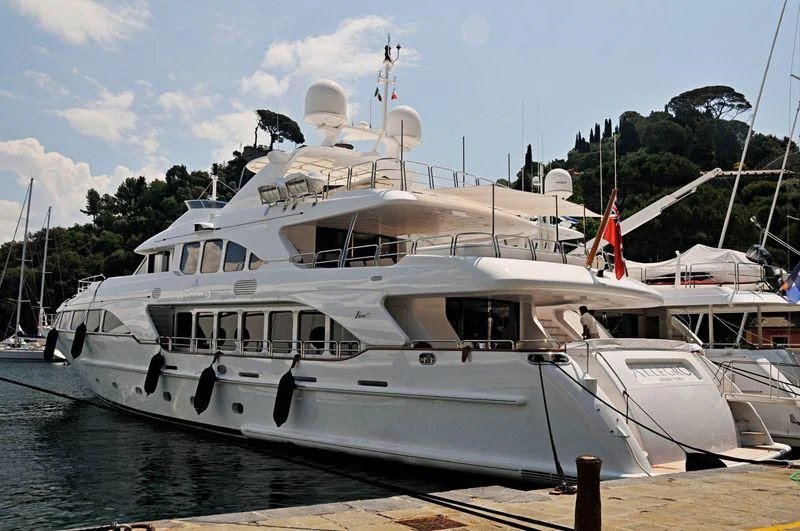 a boat docked at a pier aboard CRISTOBAL Yacht for Charter