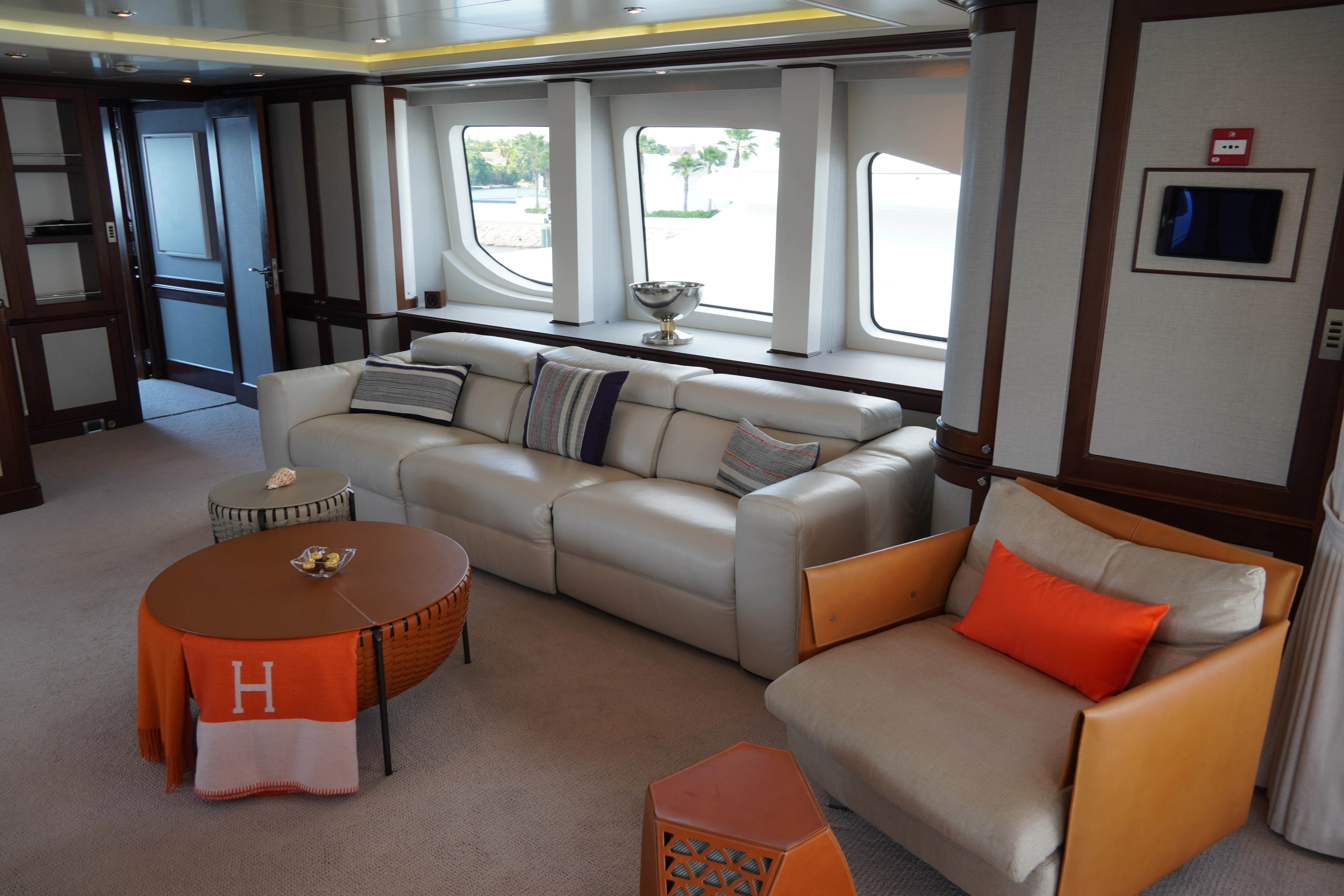 a living room with a couch and a table aboard CRISTOBAL Yacht for Charter