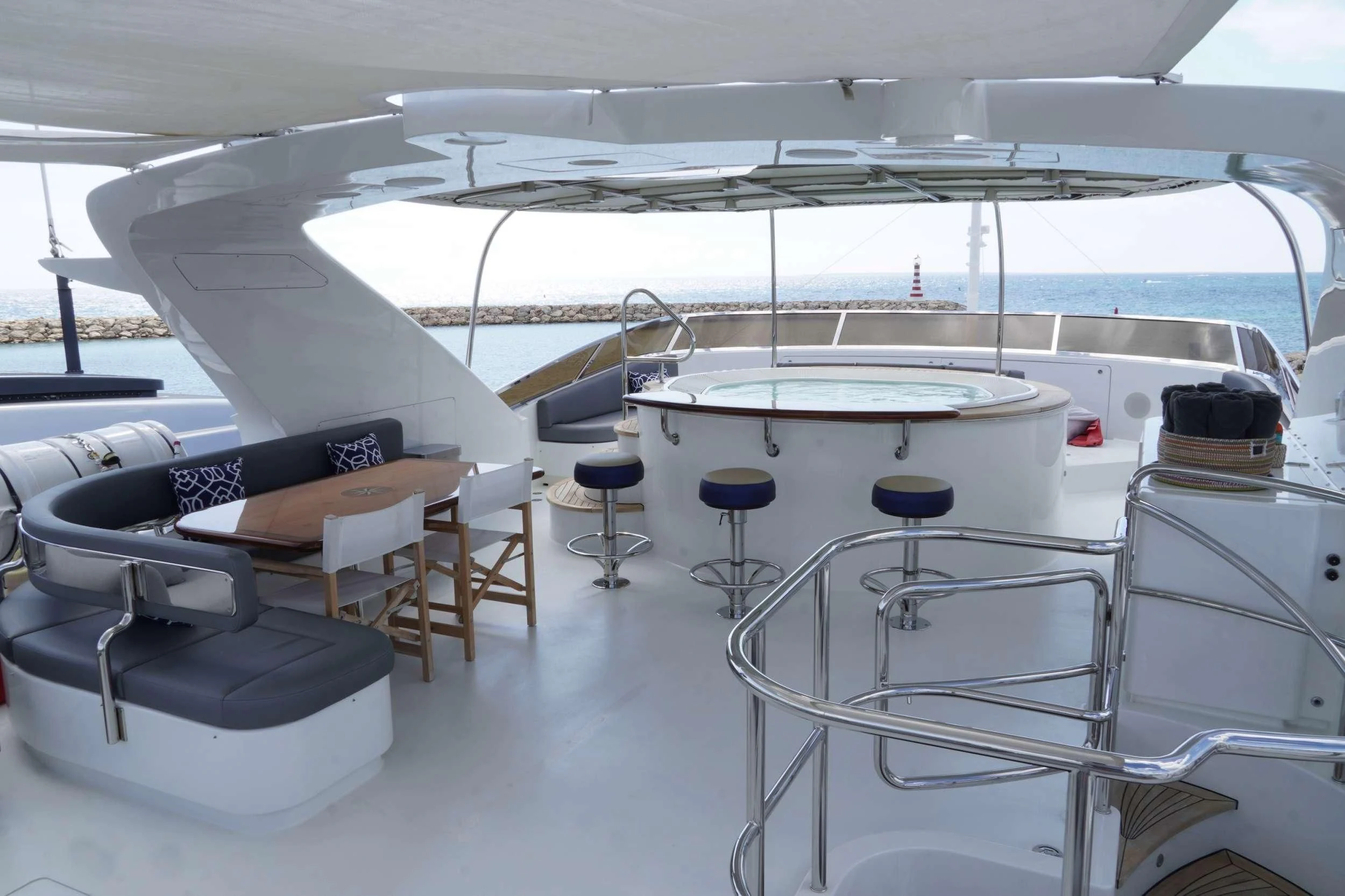 a white yacht with chairs and tables aboard CRISTOBAL Yacht for Charter