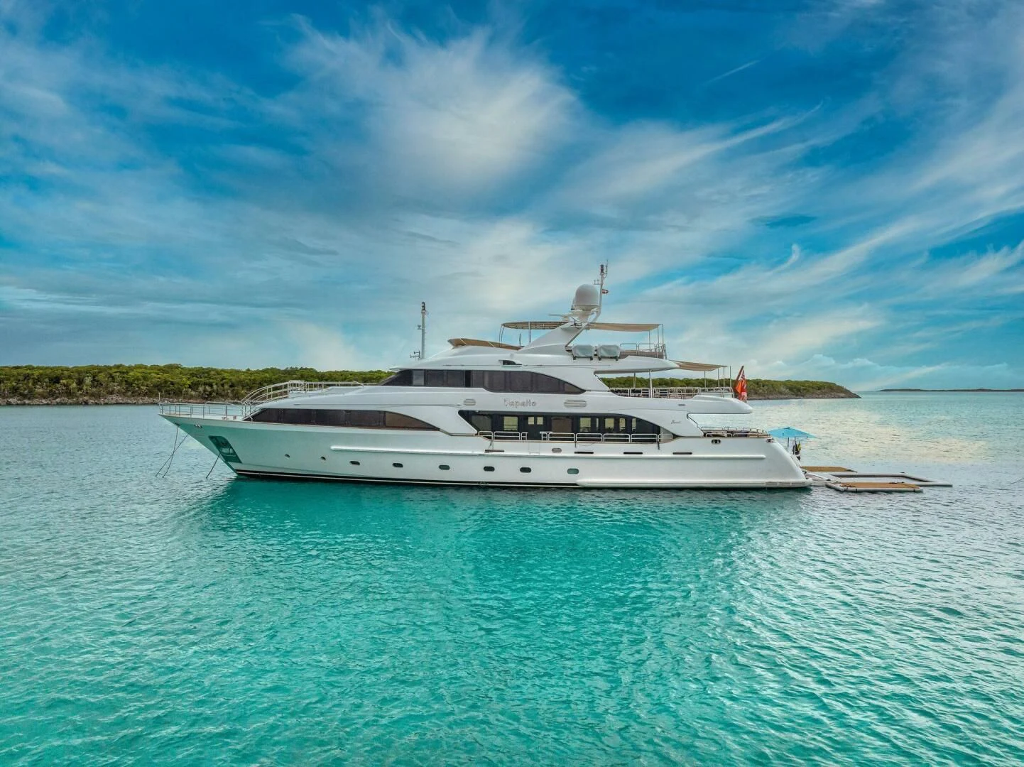 a large white boat in the water aboard CRISTOBAL Yacht for Charter