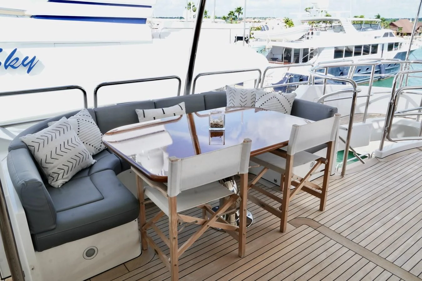 a table and chairs on a deck aboard CRISTOBAL Yacht for Charter