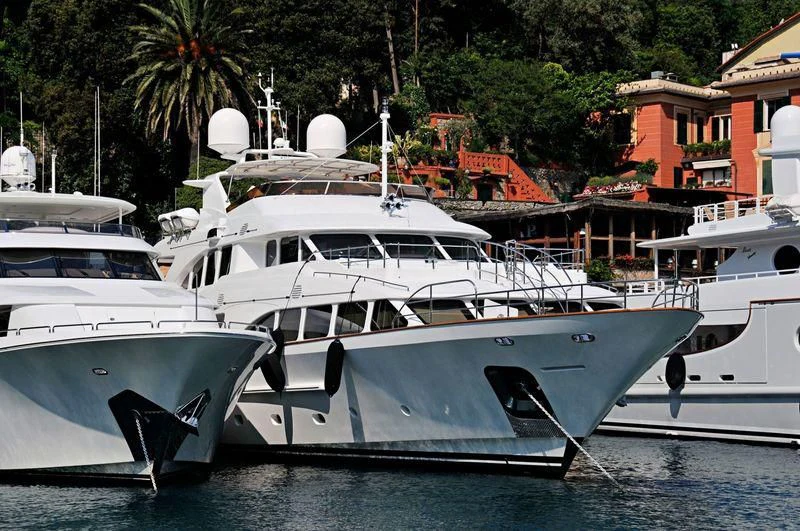 several boats docked in a harbor aboard CRISTOBAL Yacht for Charter
