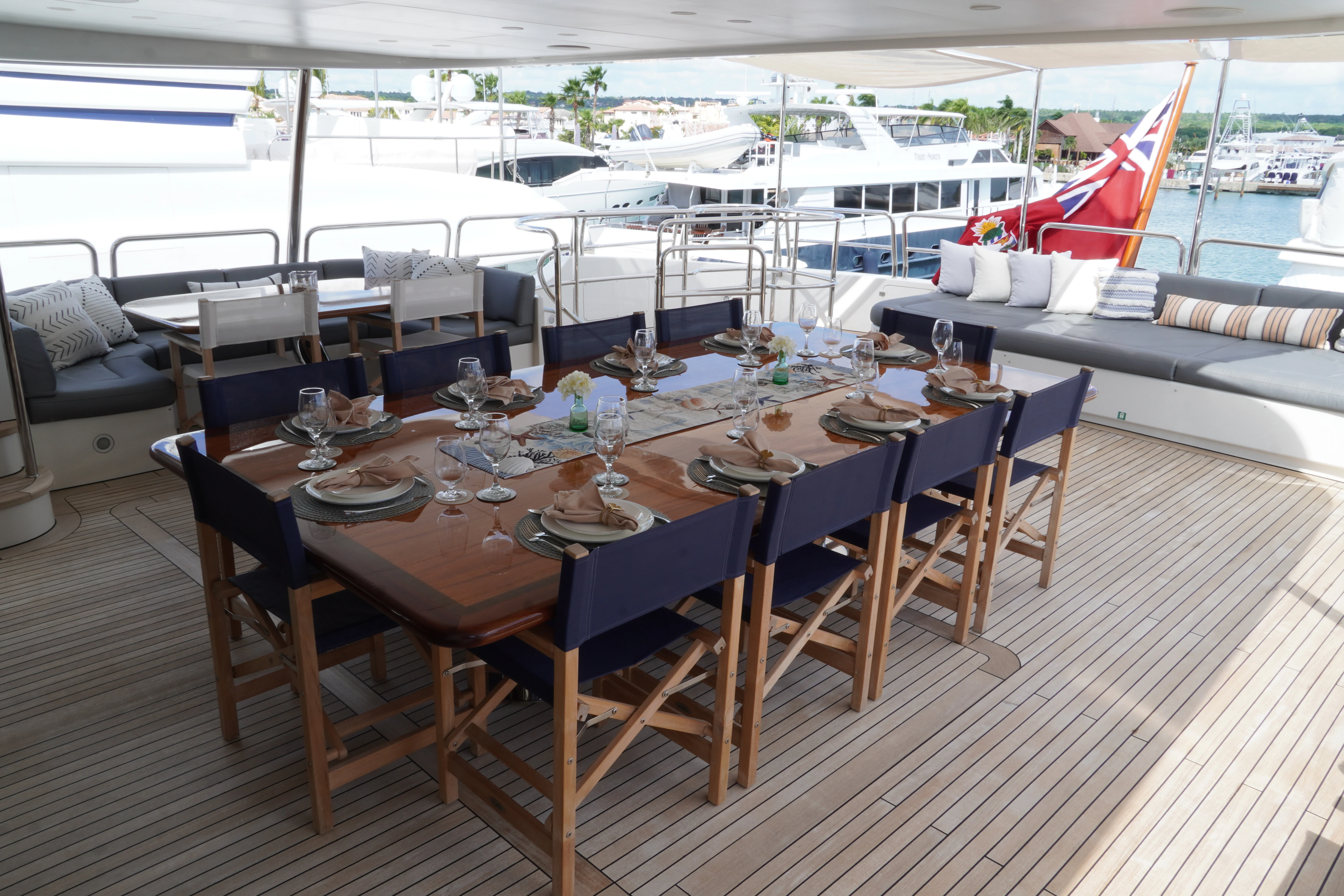 a table set for a dinner aboard CRISTOBAL Yacht for Charter