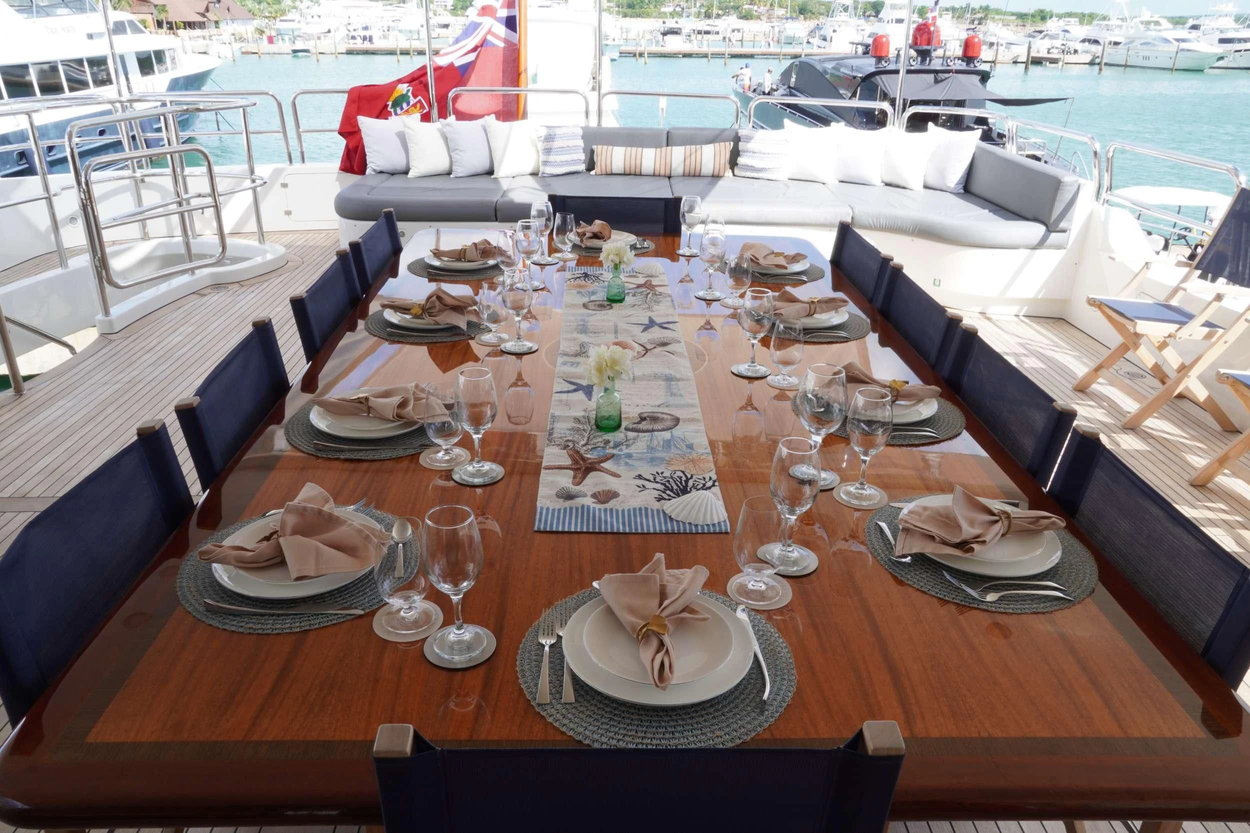 a table with plates and glasses on it aboard CRISTOBAL Yacht for Charter