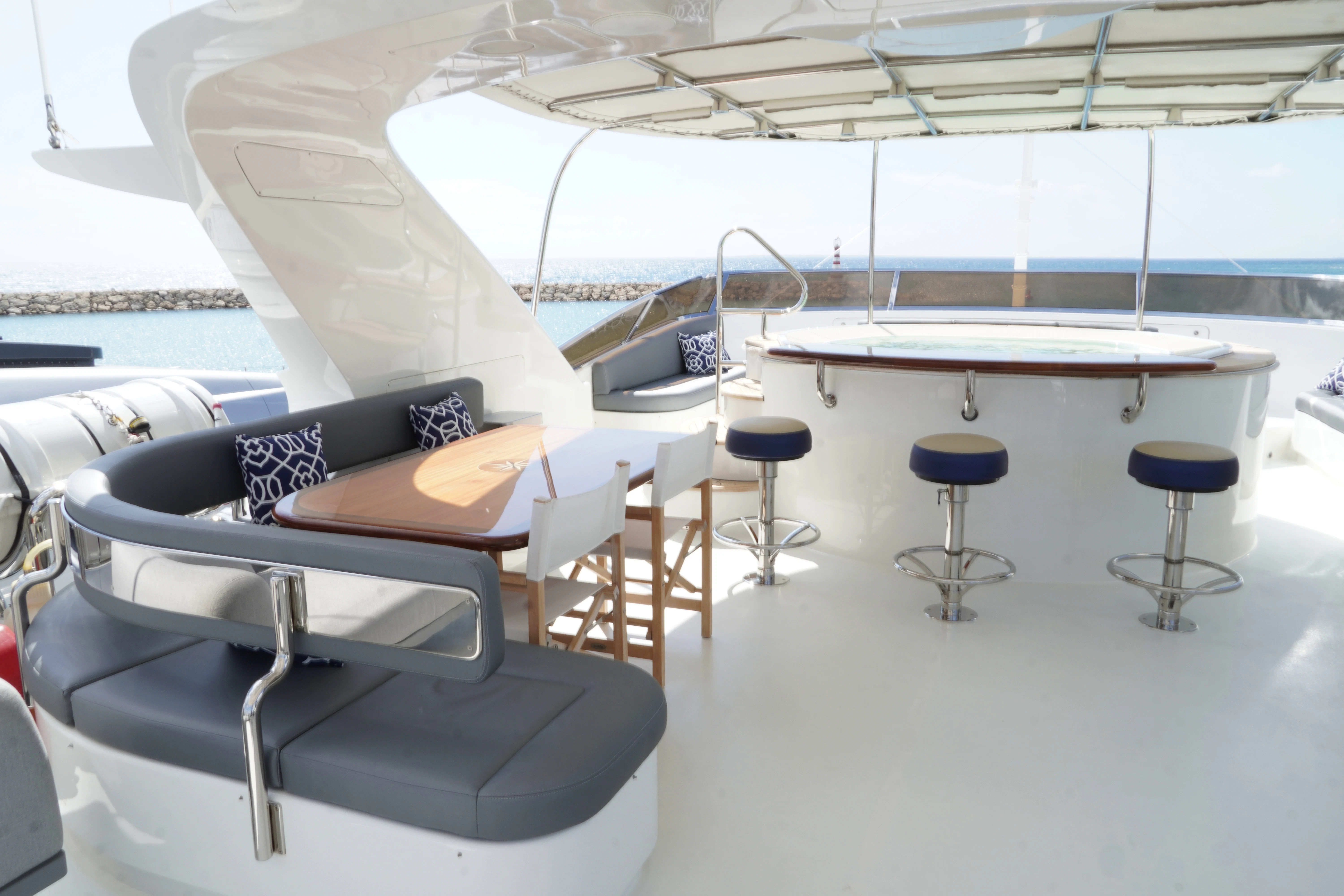 a room with tables and chairs aboard CRISTOBAL Yacht for Charter