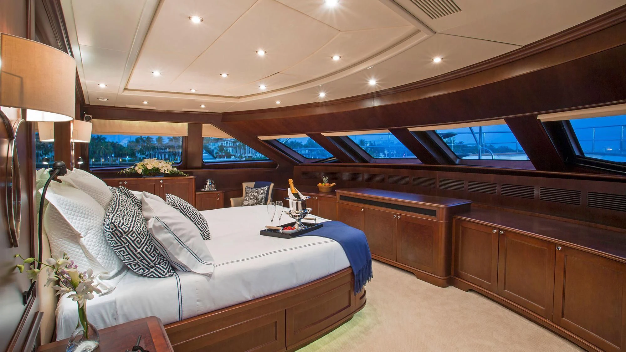 a room with a bed and a desk aboard CRISTOBAL Yacht for Charter