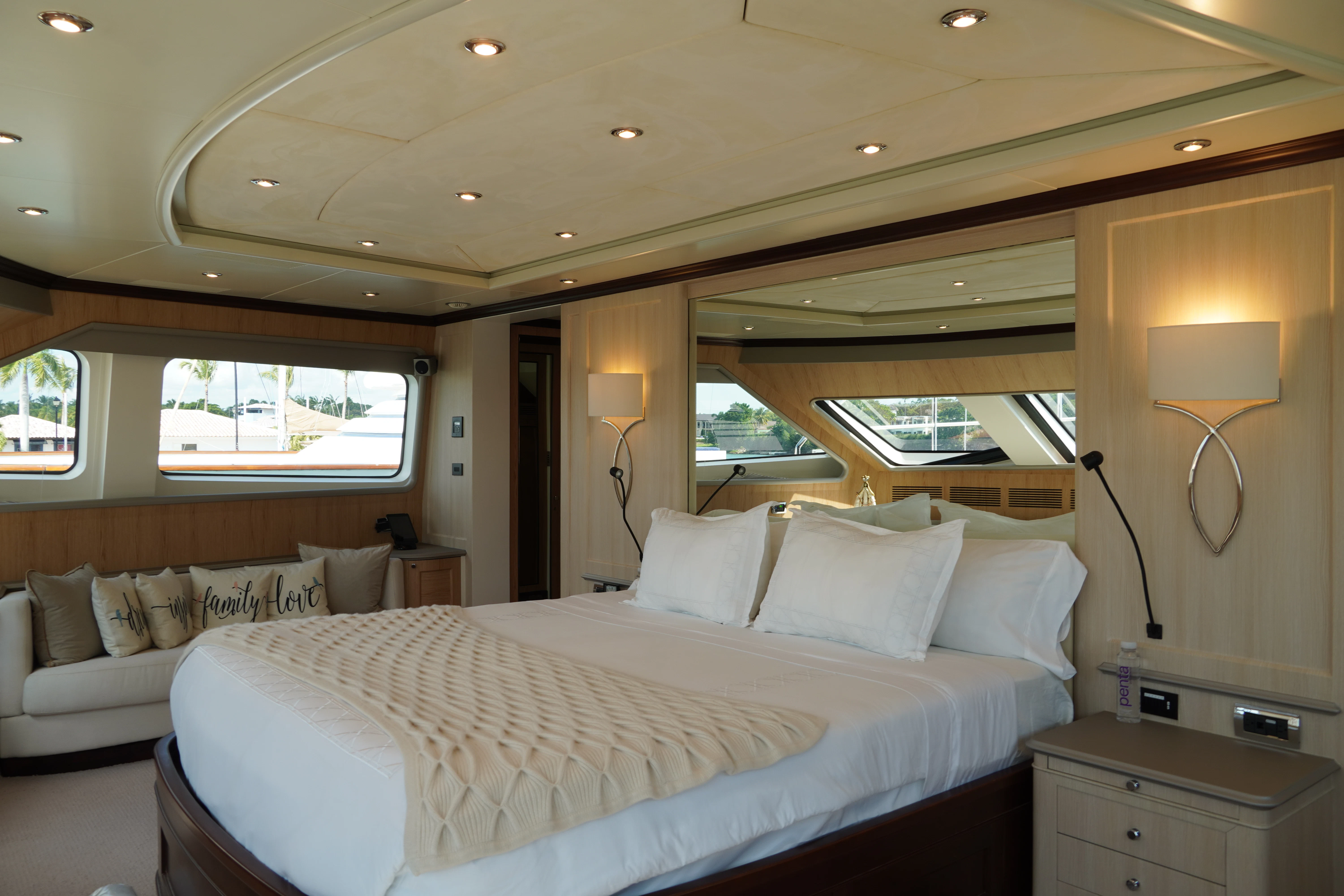 a room with a bed and a window aboard CRISTOBAL Yacht for Charter