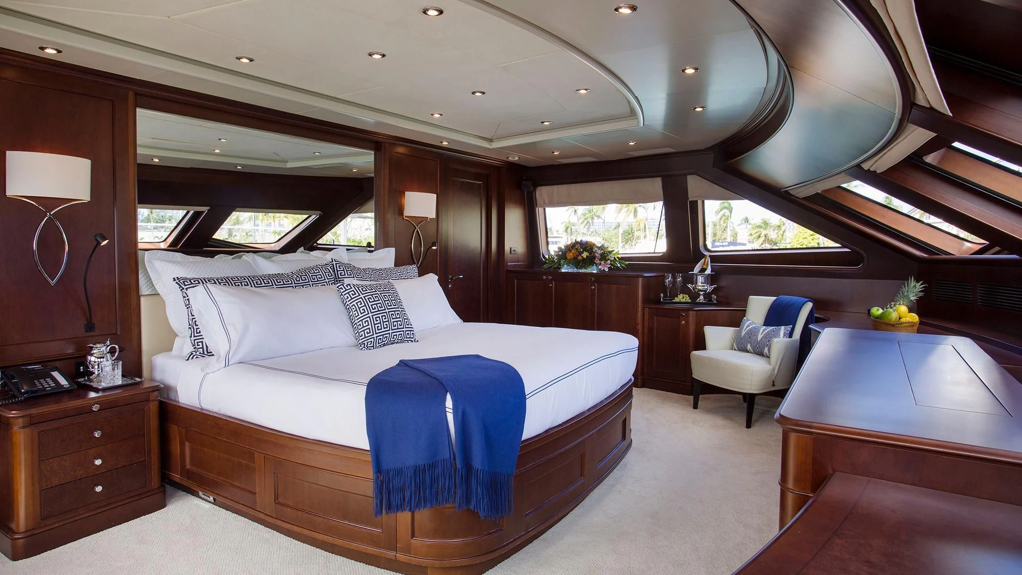 a bedroom with a large bed aboard CRISTOBAL Yacht for Charter
