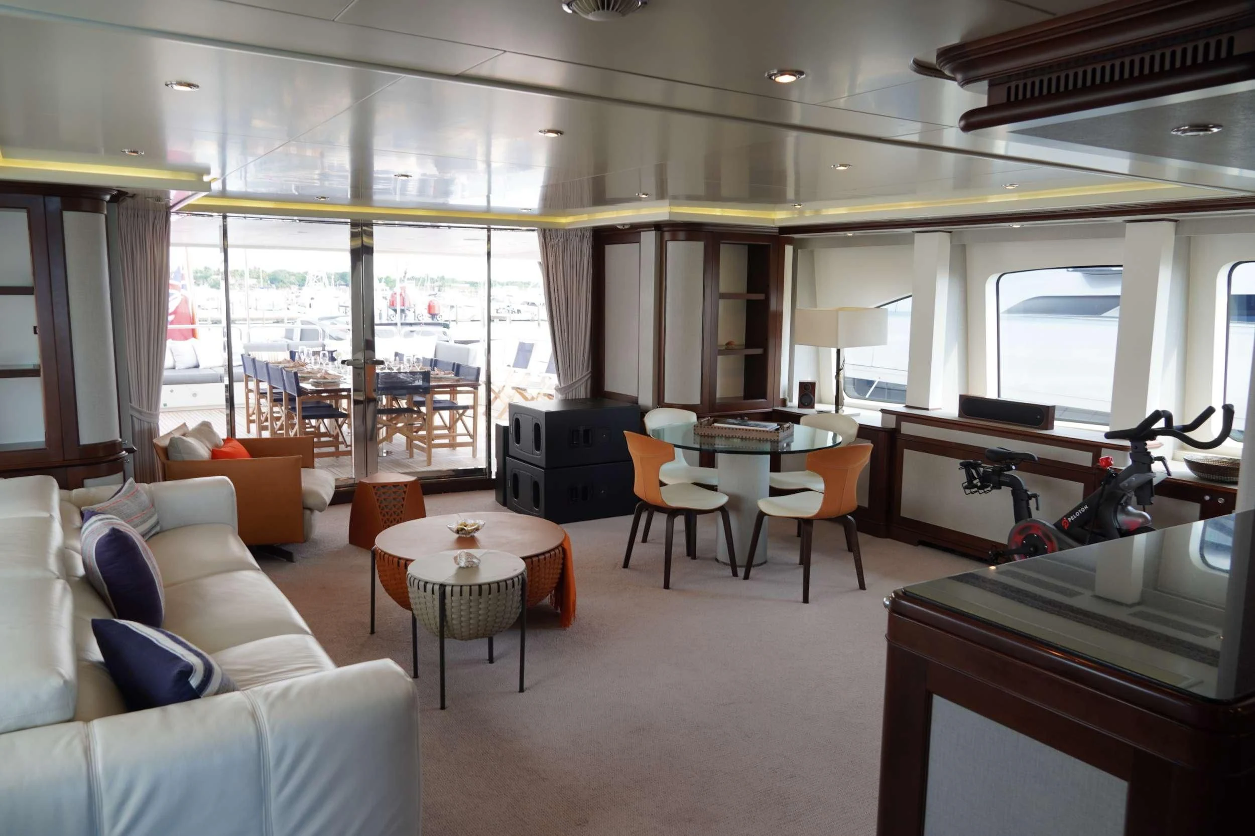 a living room with a large window aboard CRISTOBAL Yacht for Charter