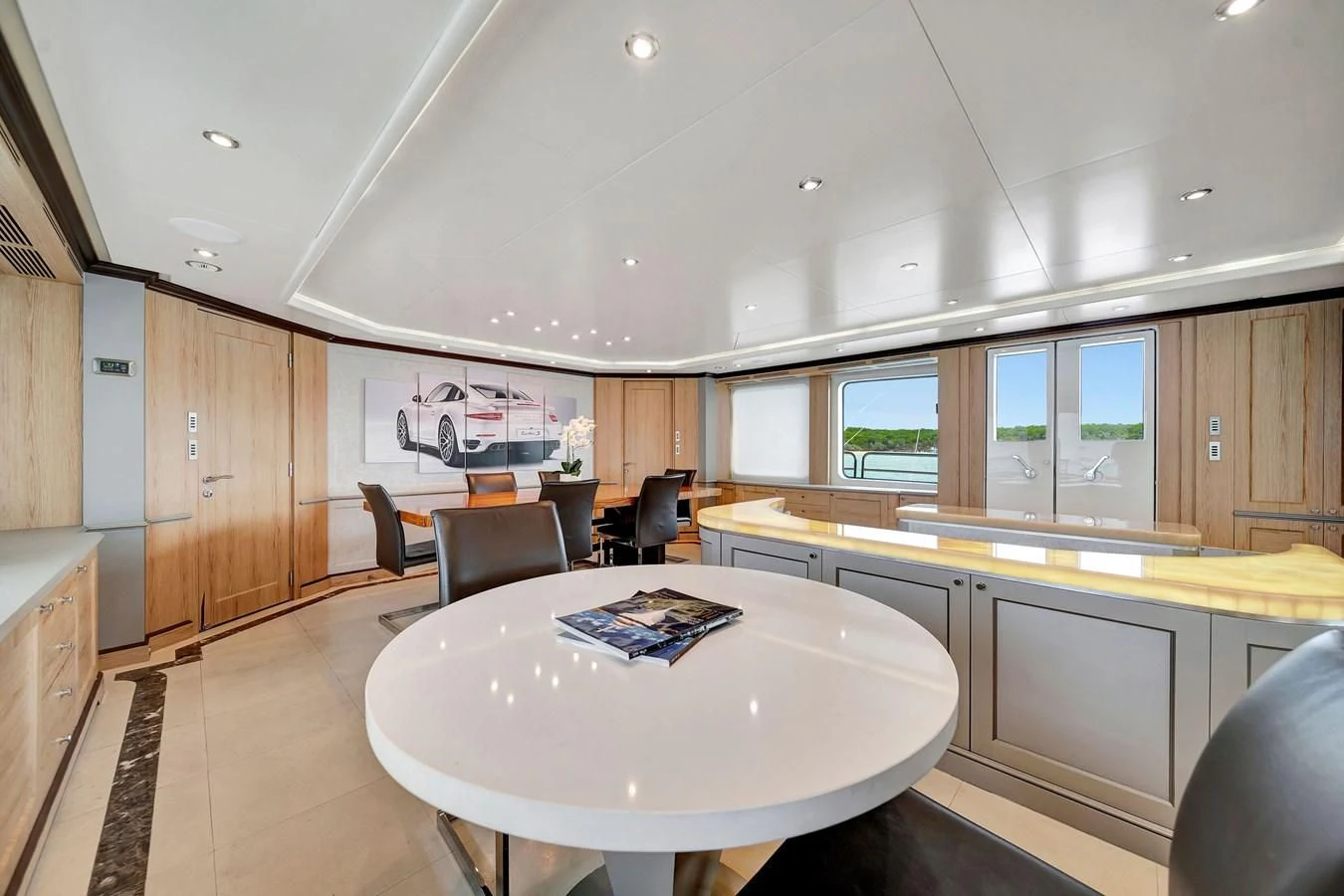a large kitchen with a table aboard CRISTOBAL Yacht for Charter