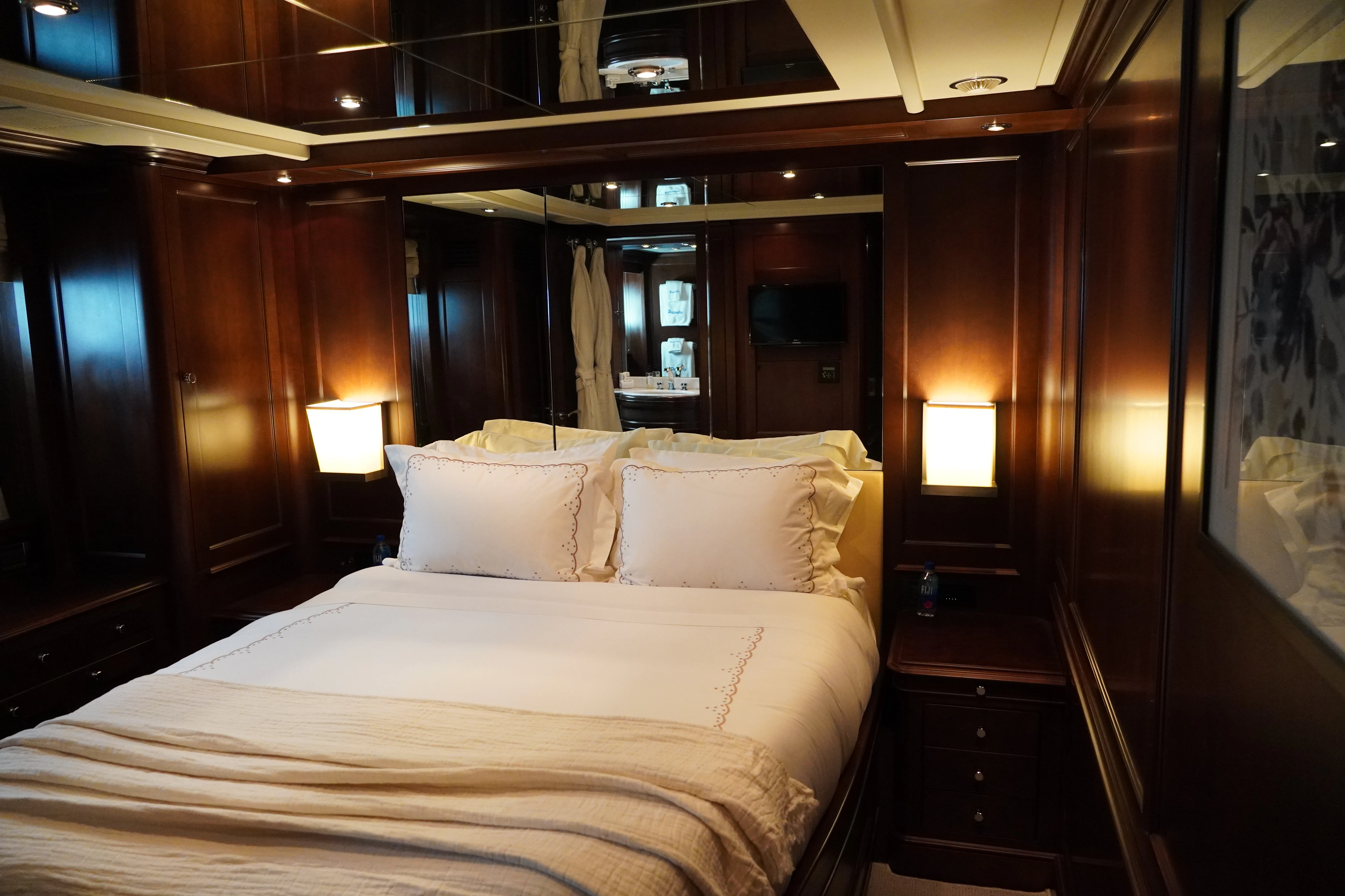 a bed in a room aboard CRISTOBAL Yacht for Charter