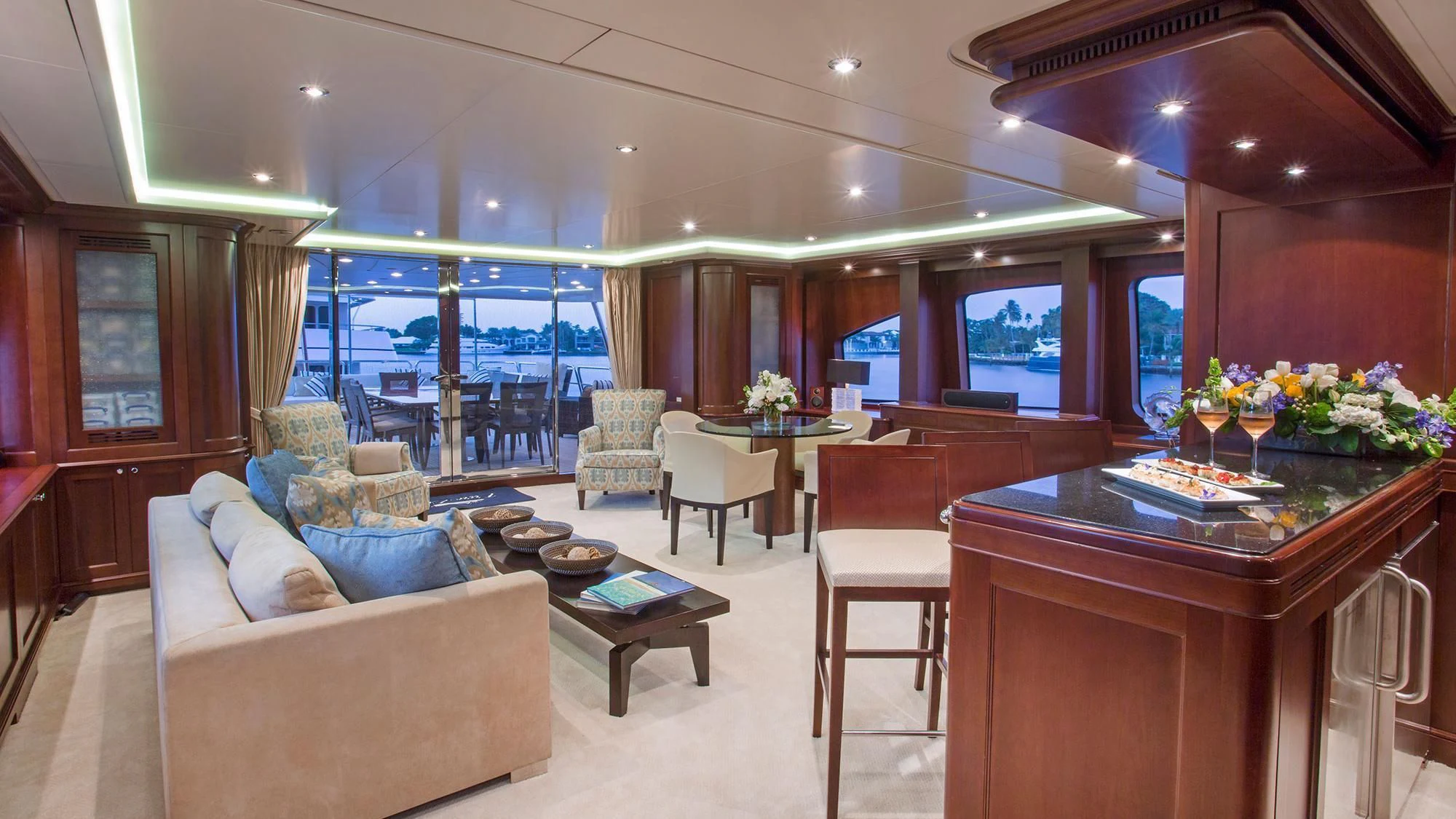 a living room with a table and chairs aboard CRISTOBAL Yacht for Charter