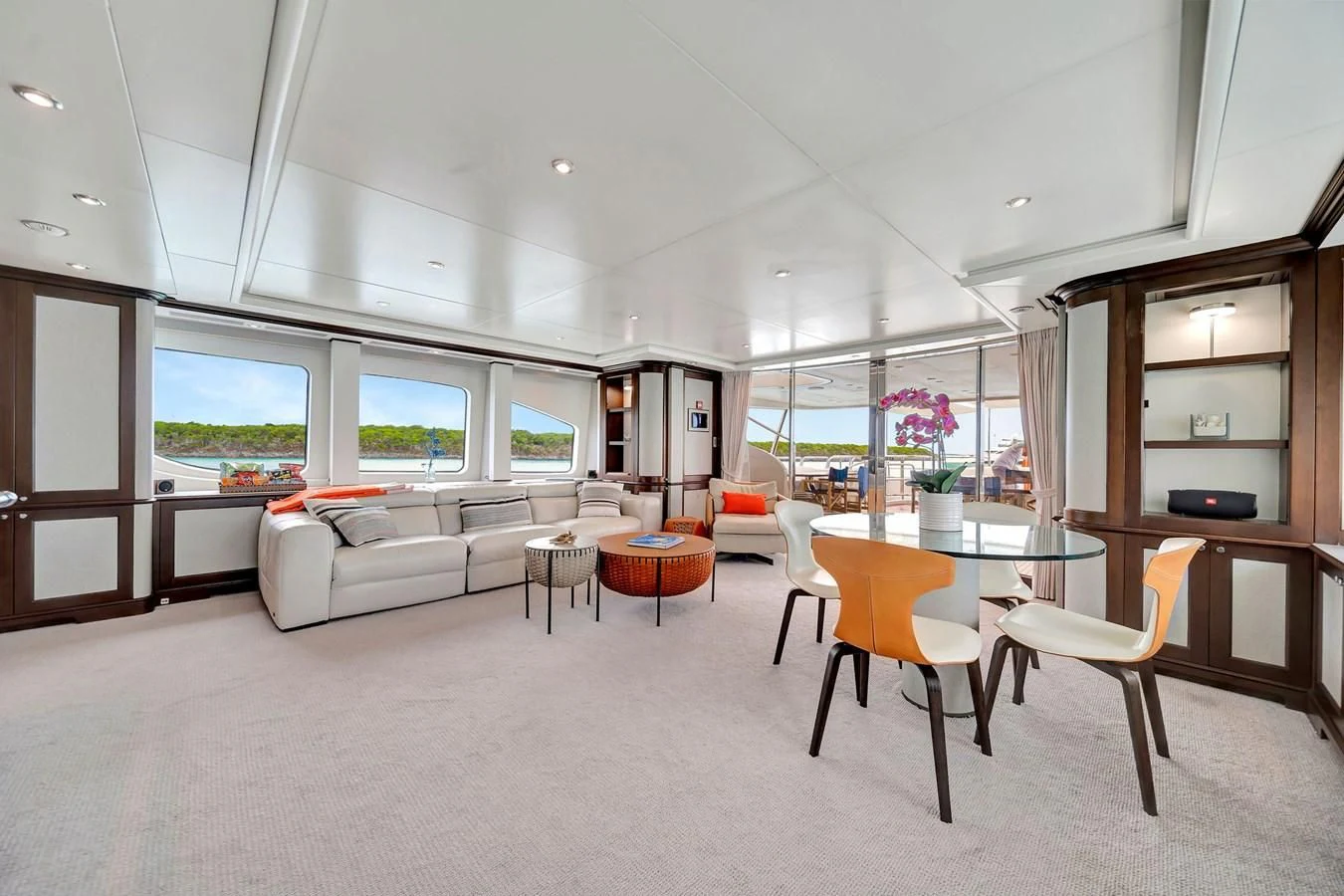 a living room with a white couch and a table aboard CRISTOBAL Yacht for Charter