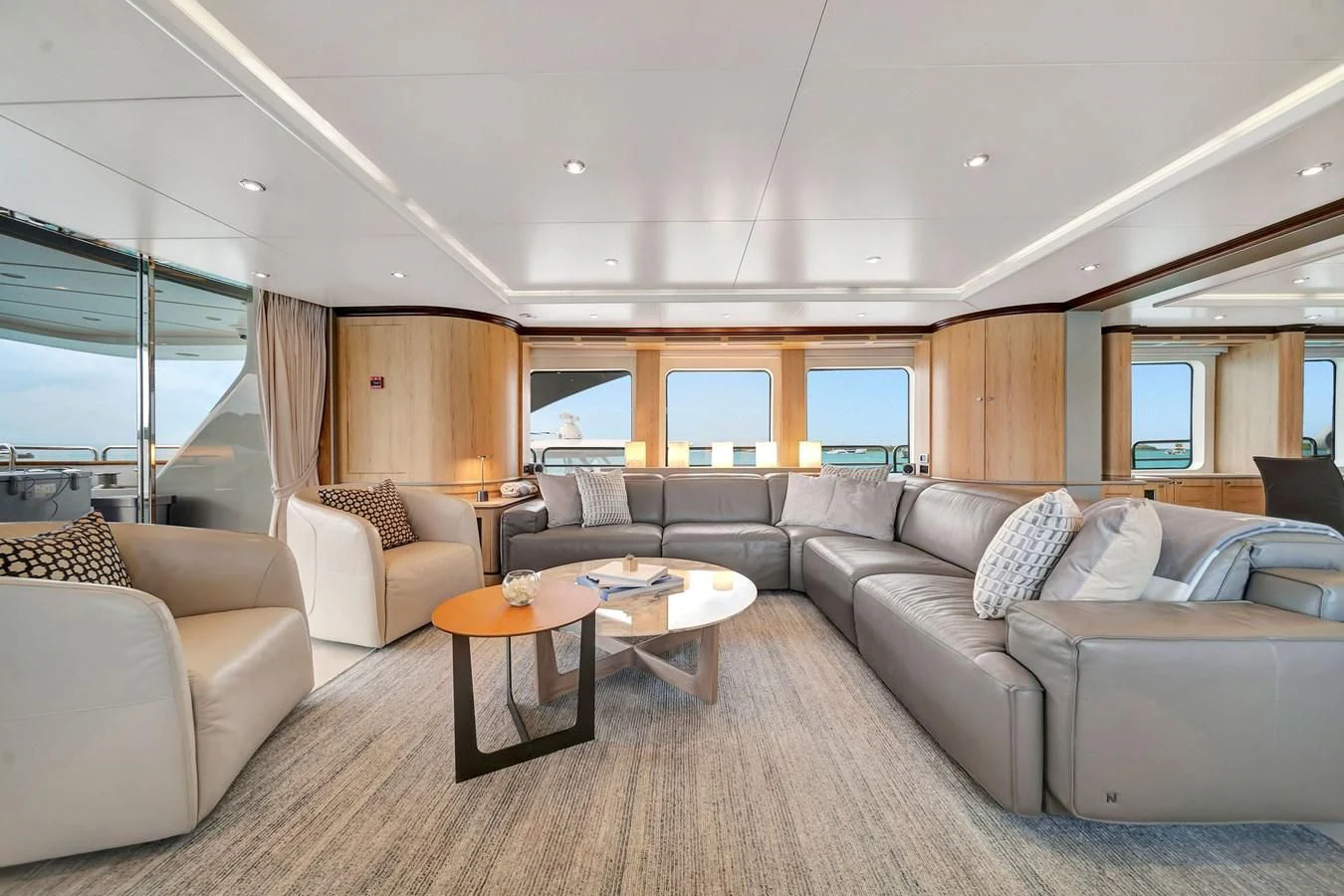 a living room with a large sofa aboard CRISTOBAL Yacht for Charter