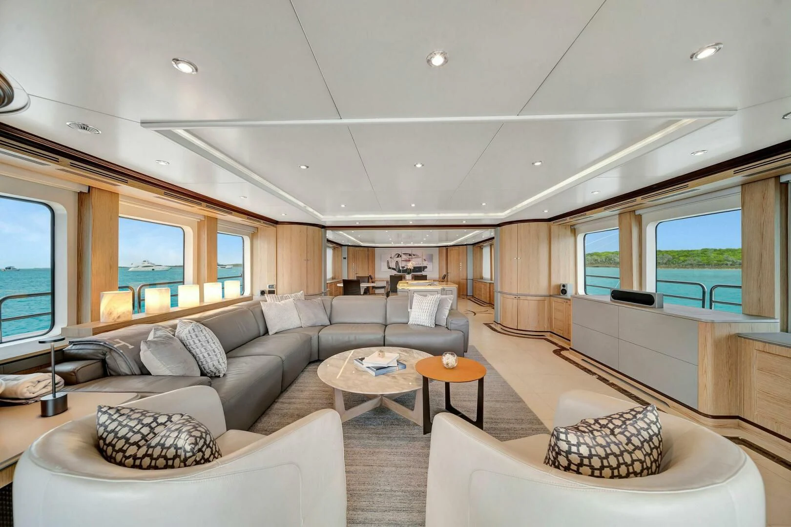 a living room with a large window aboard CRISTOBAL Yacht for Charter