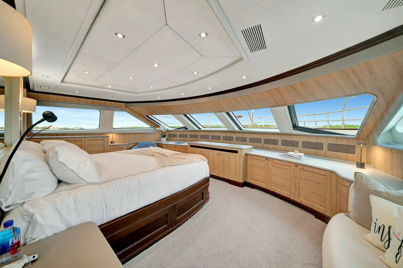a room with a bed and a couch aboard CRISTOBAL Yacht for Charter