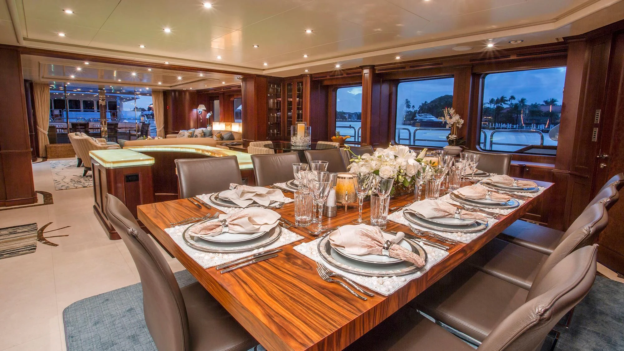a dining room with a table set for a meal aboard CRISTOBAL Yacht for Charter