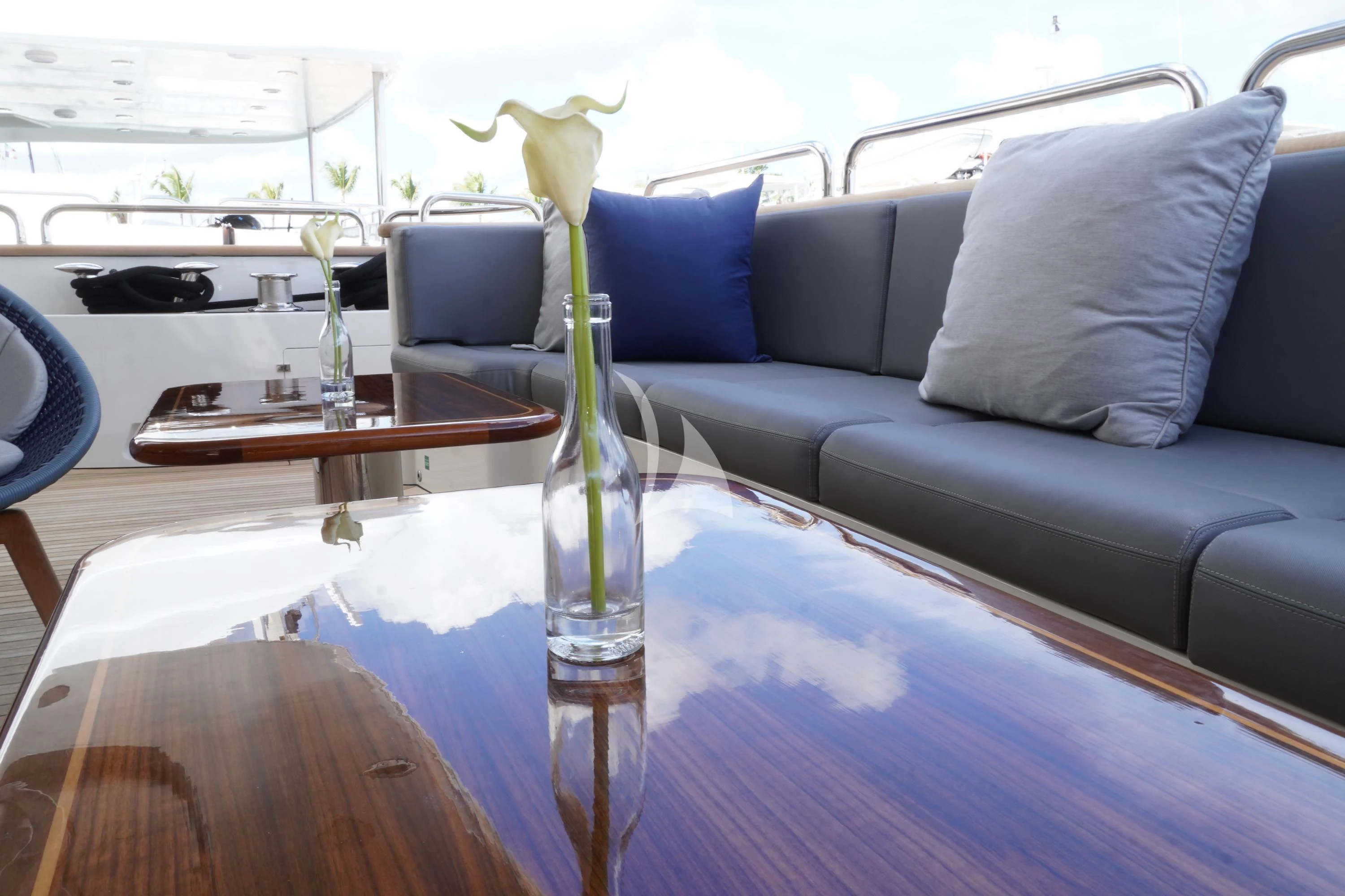 a vase with flowers on a table aboard CRISTOBAL Yacht for Charter