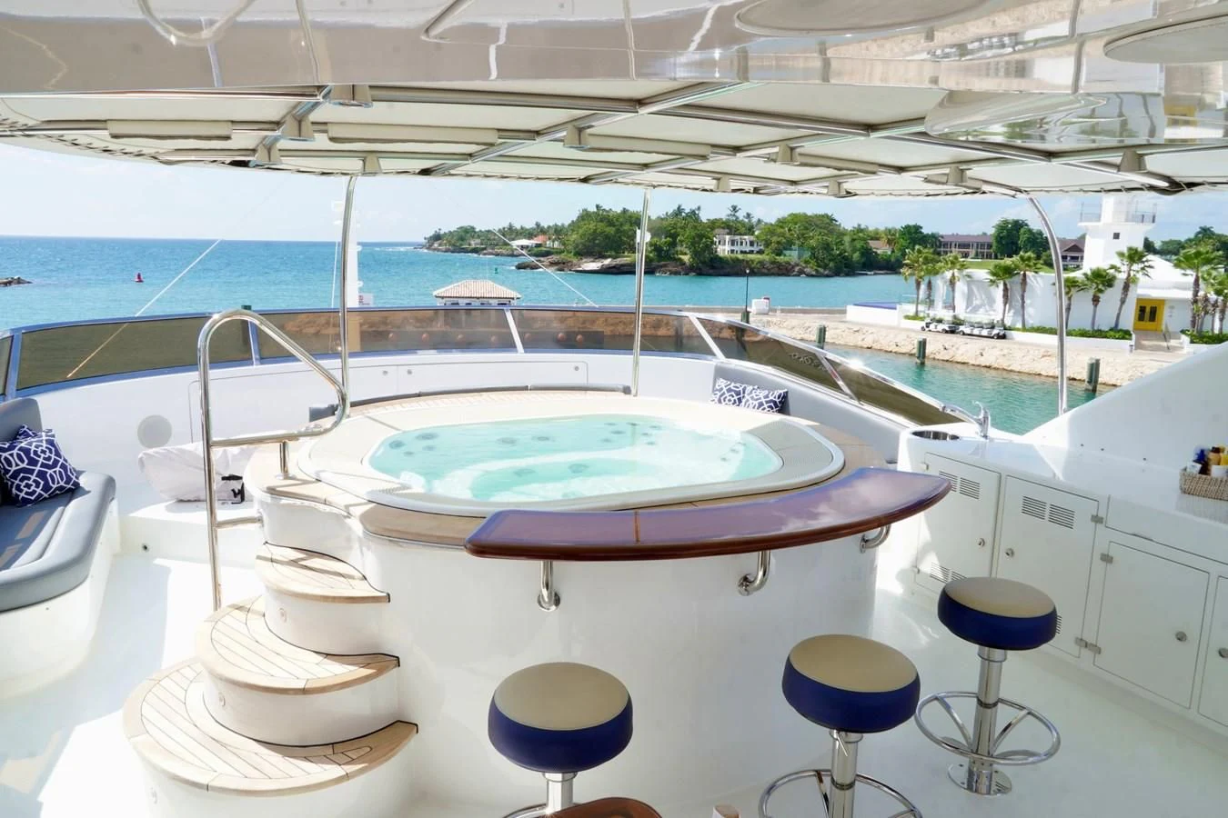 a pool with tables and chairs aboard CRISTOBAL Yacht for Charter