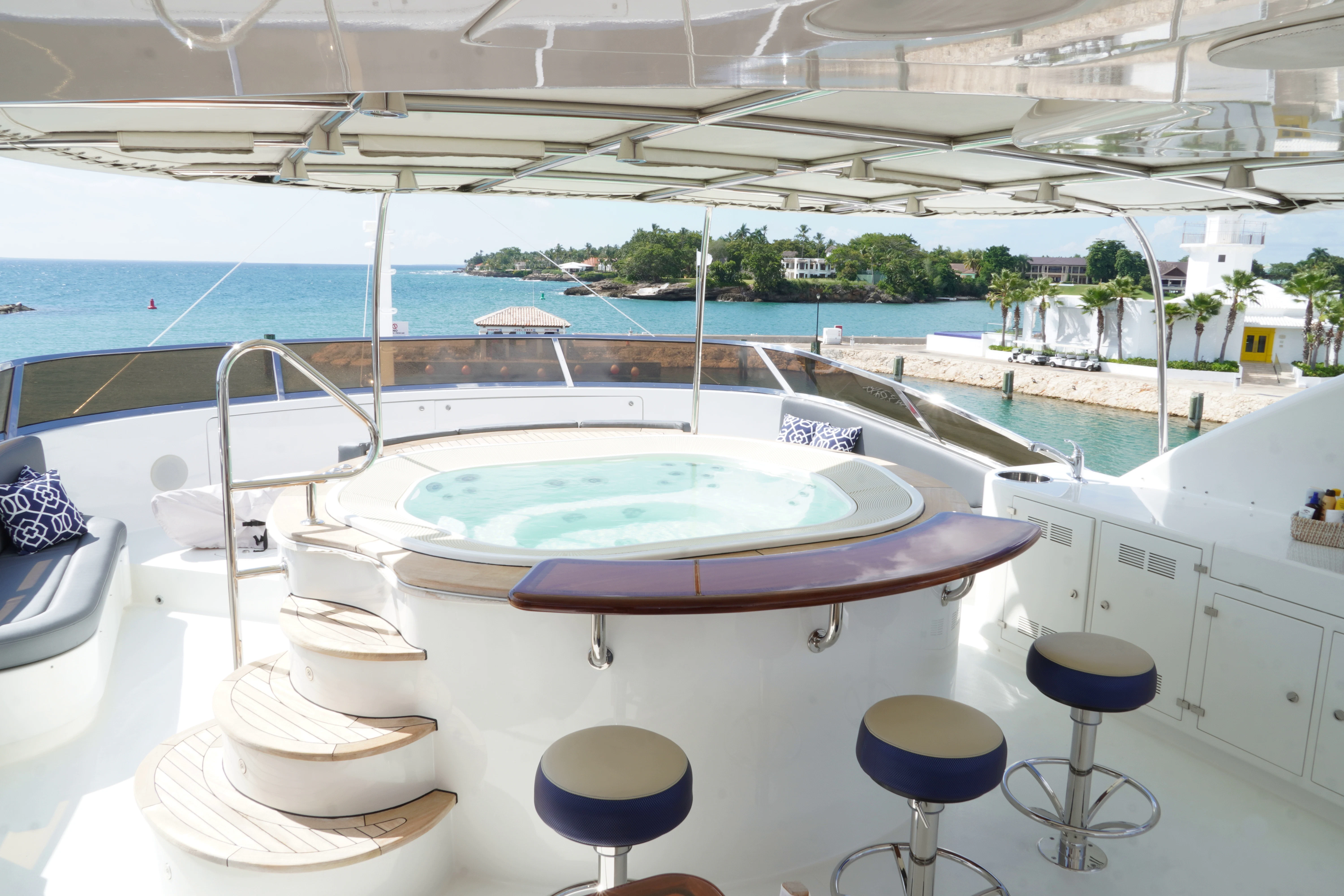 a pool with a table and chairs aboard CRISTOBAL Yacht for Charter