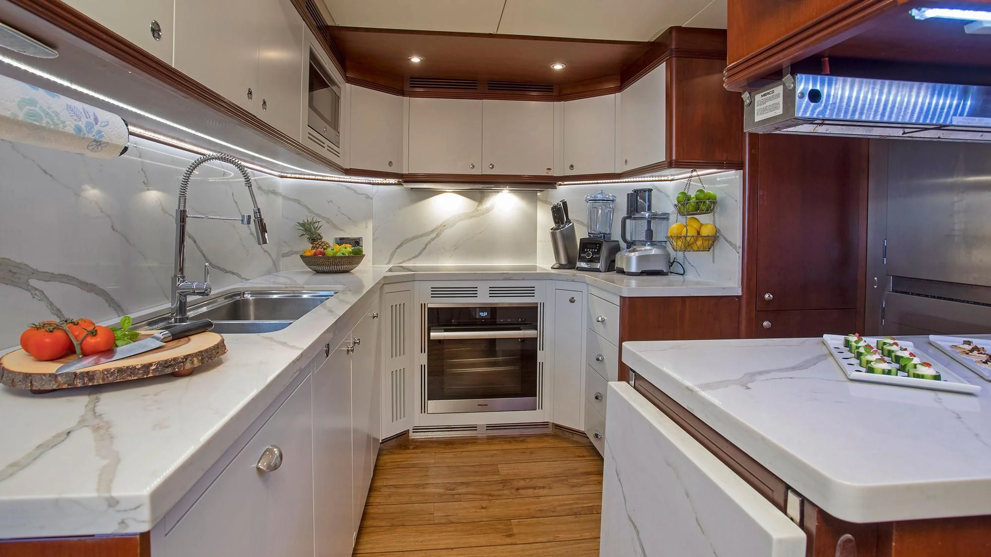 a kitchen with white cabinets aboard CRISTOBAL Yacht for Charter