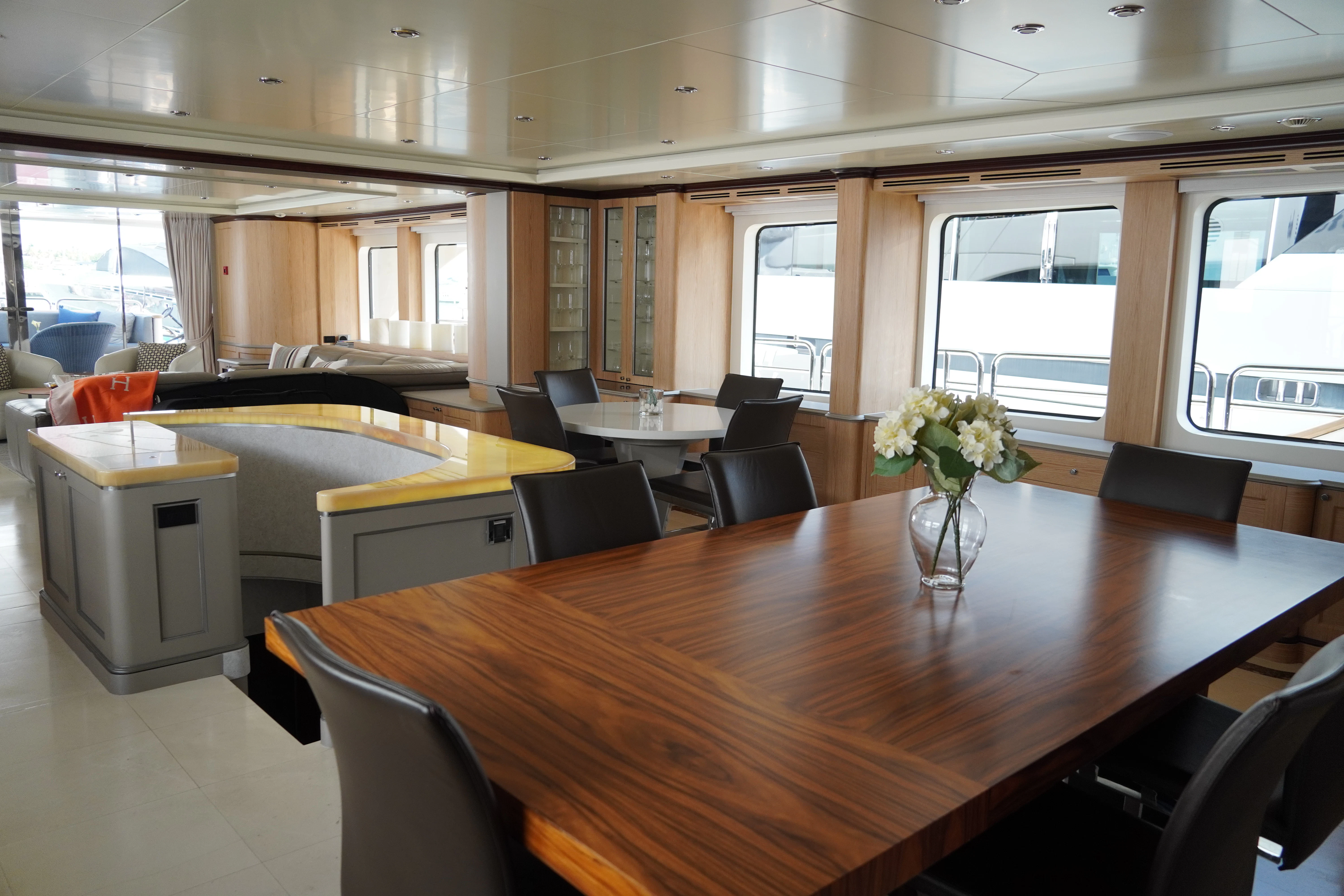 a large room with a table and chairs aboard CRISTOBAL Yacht for Charter