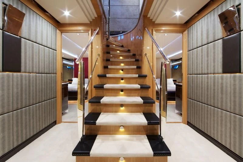 a long hallway with several doors aboard CODE 8 Yacht for Sale