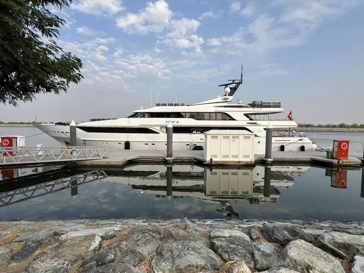 a boat docked at a pier aboard CODE 8 Yacht for Sale
