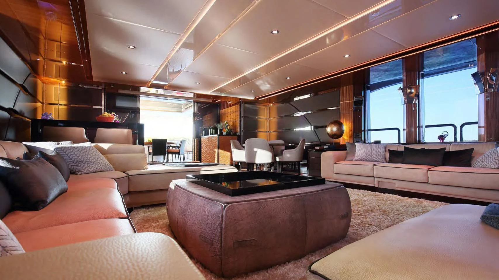a living room with a large fireplace aboard CODE 8 Yacht for Sale
