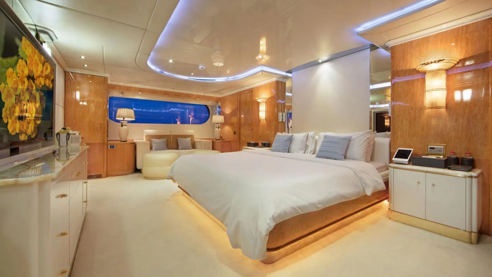 a large bedroom with a large bed aboard CODE 8 Yacht for Sale