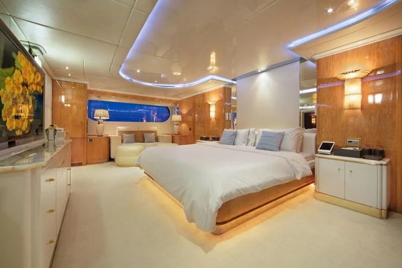 a room with a bed and a desk aboard CODE 8 Yacht for Sale